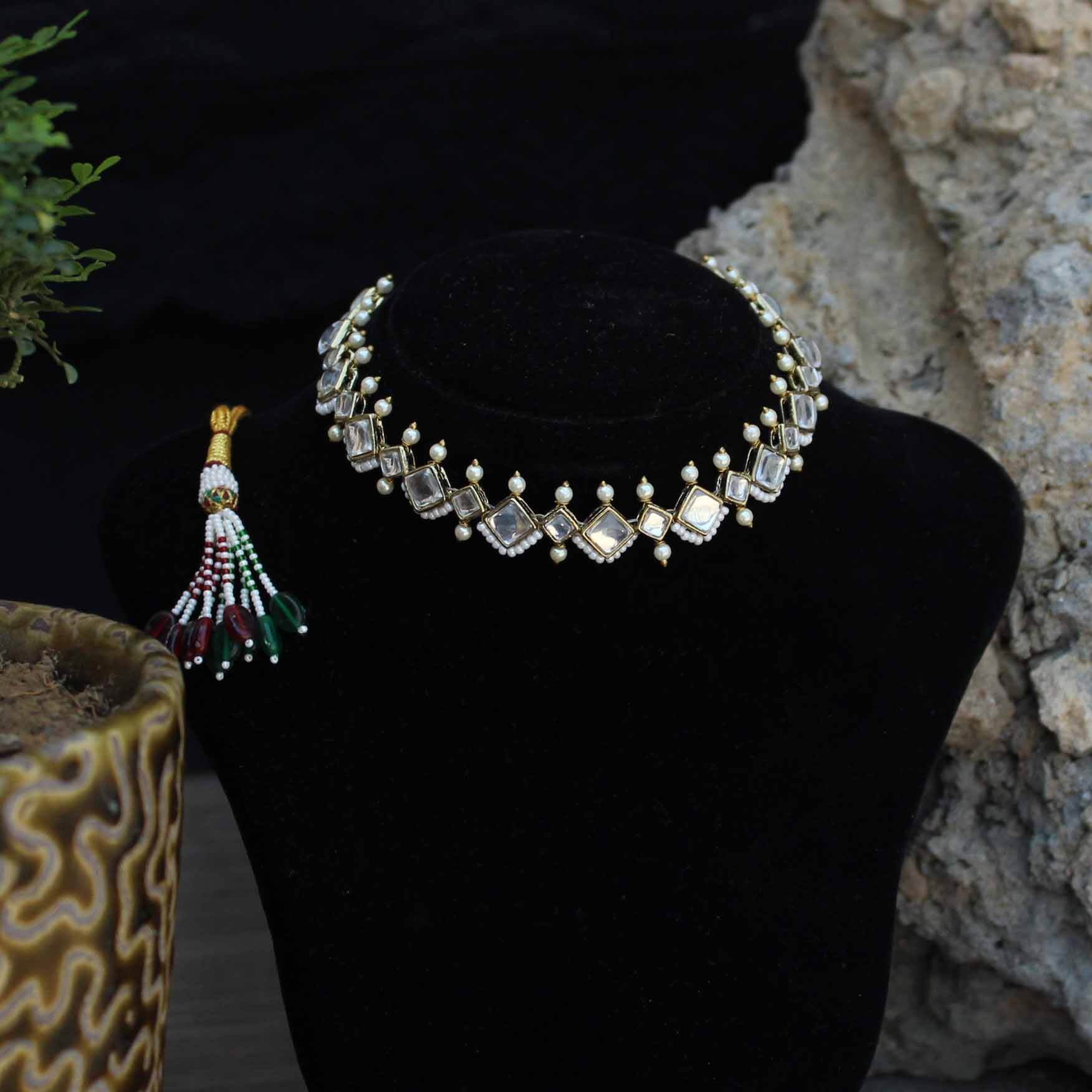 Kundan choker set in gold-tone with matching earrings and long bridal necklace, perfect for wedding functions , festive and bridal wear