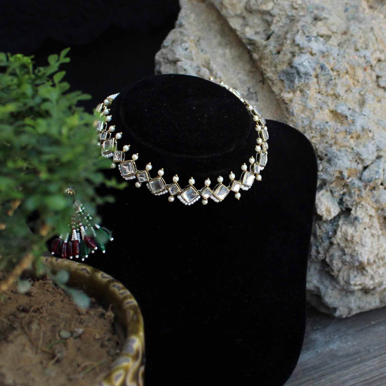 Kundan choker set in gold-tone with matching earrings and long bridal necklace, perfect for wedding functions , festive and bridal wear