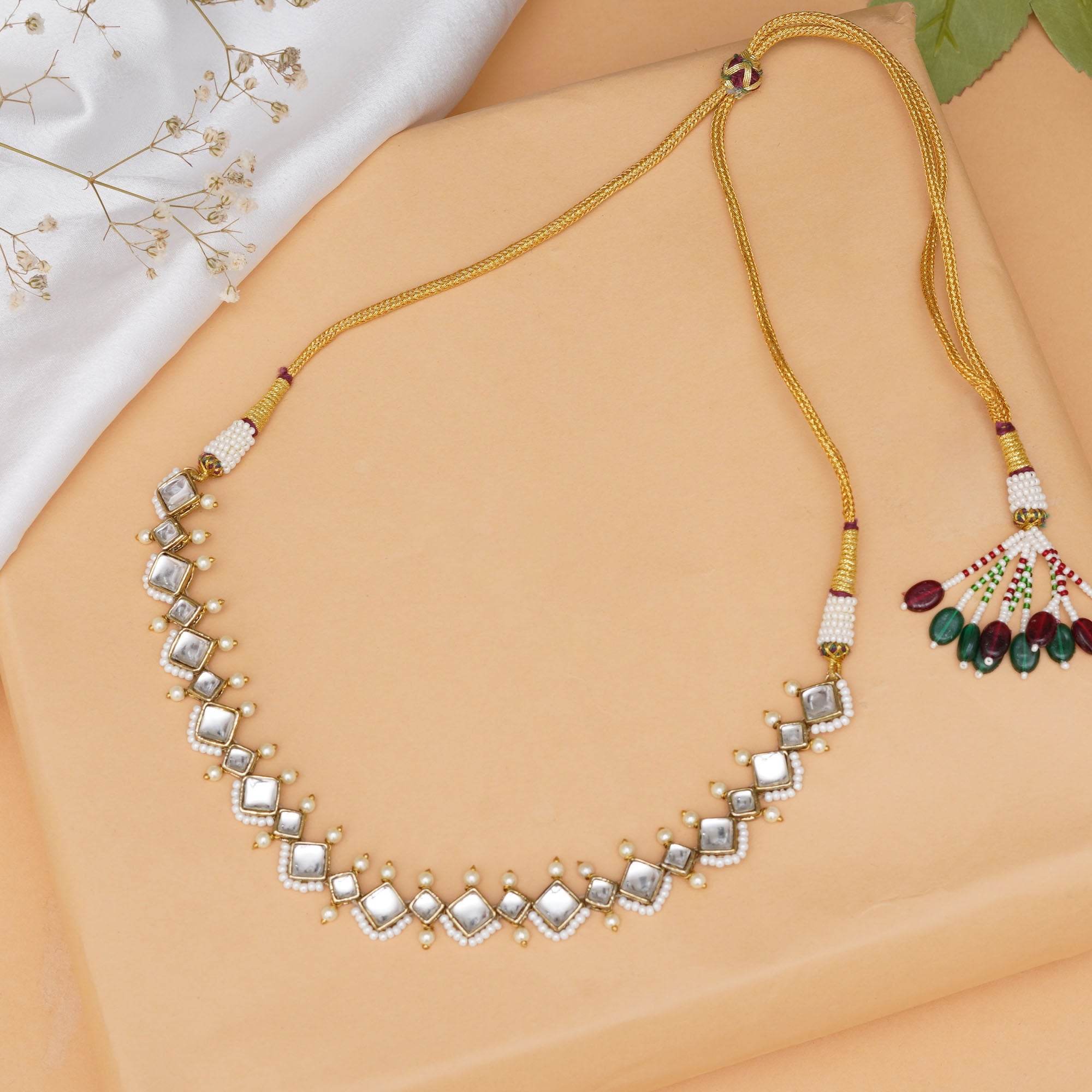 Kundan choker set in gold-tone with matching earrings and long bridal necklace, perfect for wedding functions , festive and bridal wear