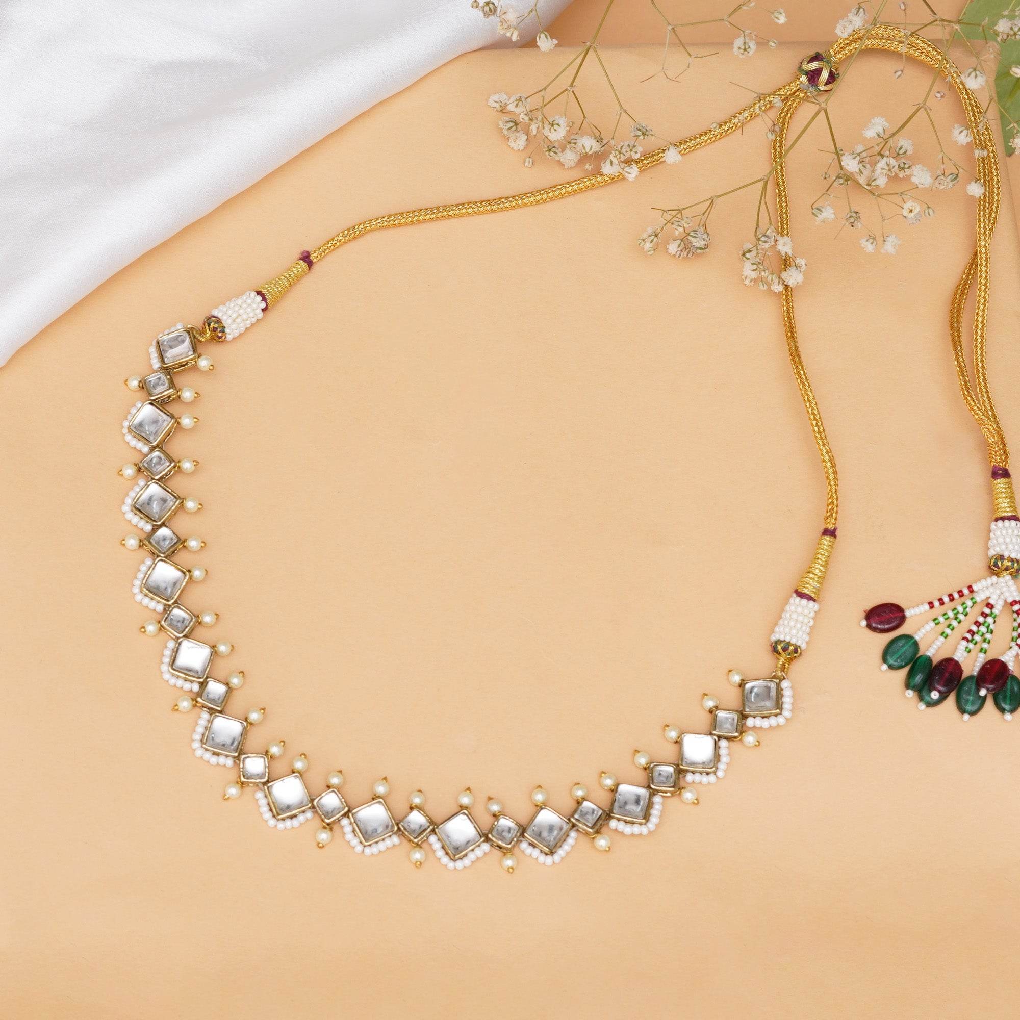 Kundan choker set in gold-tone with matching earrings and long bridal necklace, perfect for wedding functions , festive and bridal wear