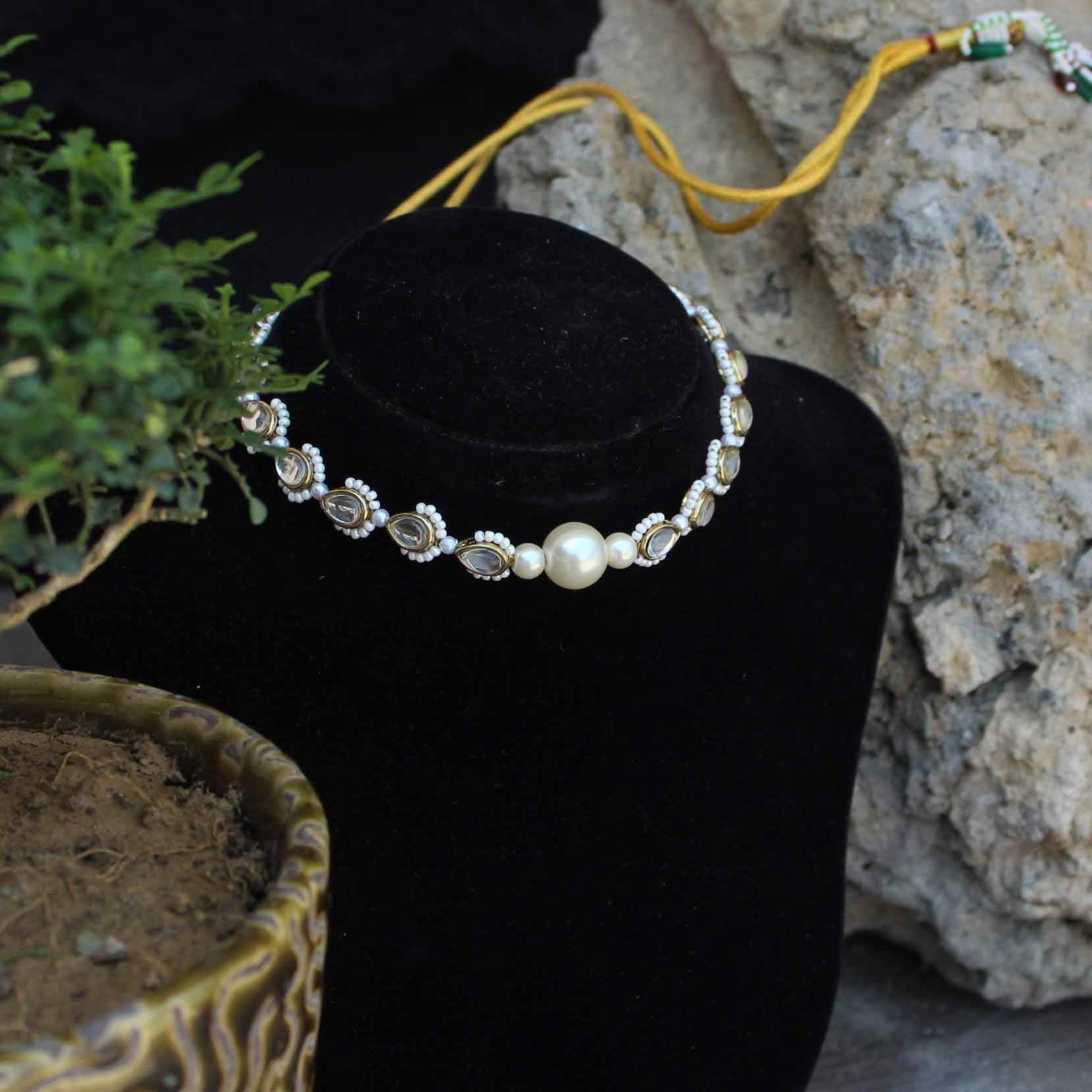 Kundan choker set in gold-tone with matching earrings and long bridal necklace, perfect for wedding functions , festive and bridal wear