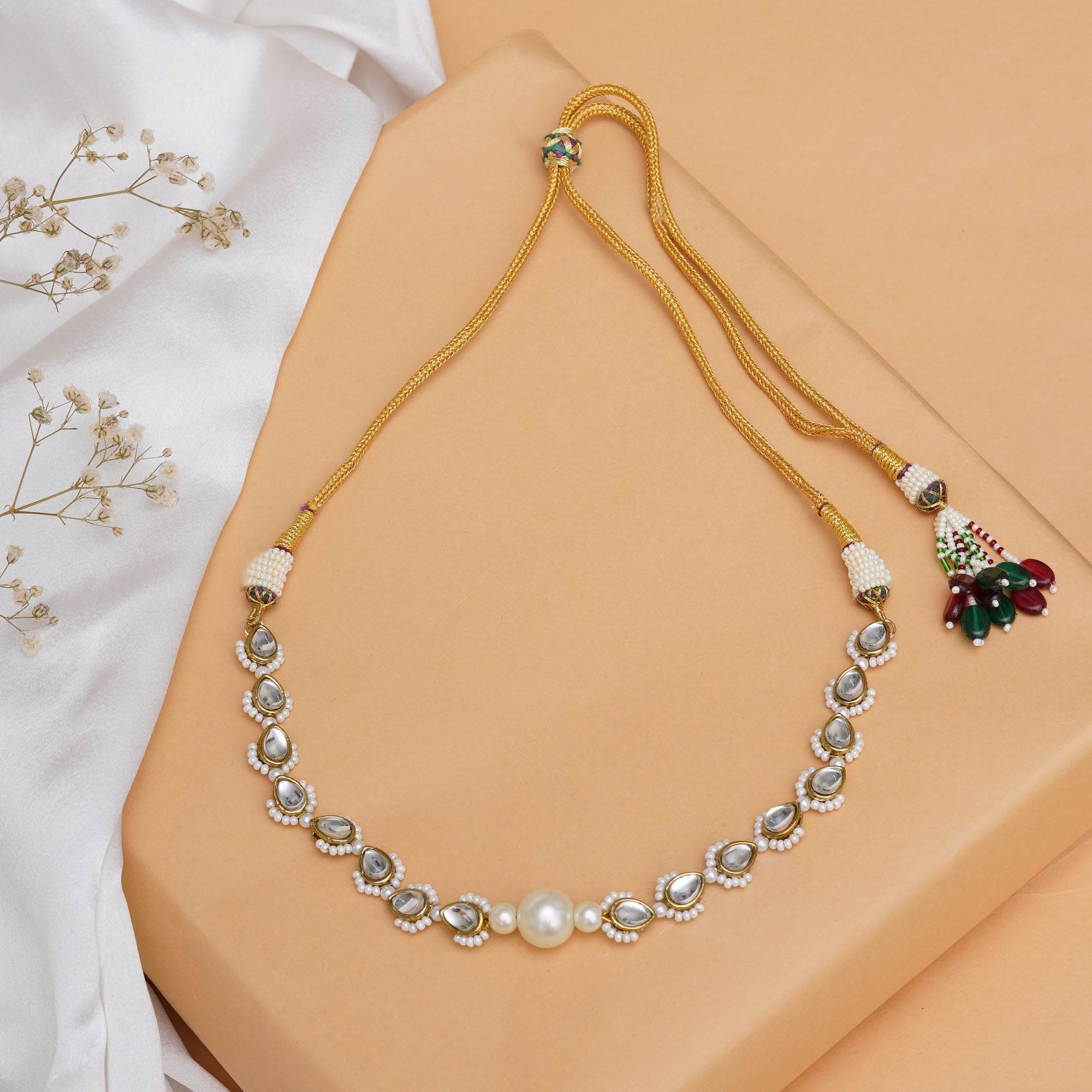 Kundan choker set in gold-tone with matching earrings and long bridal necklace, perfect for wedding functions , festive and bridal wear
