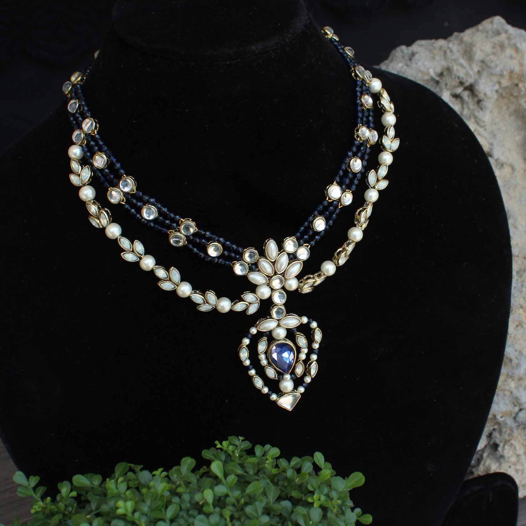 Kundan choker set in gold-tone with matching earrings and long bridal necklace, perfect for wedding functions , festive and bridal wear