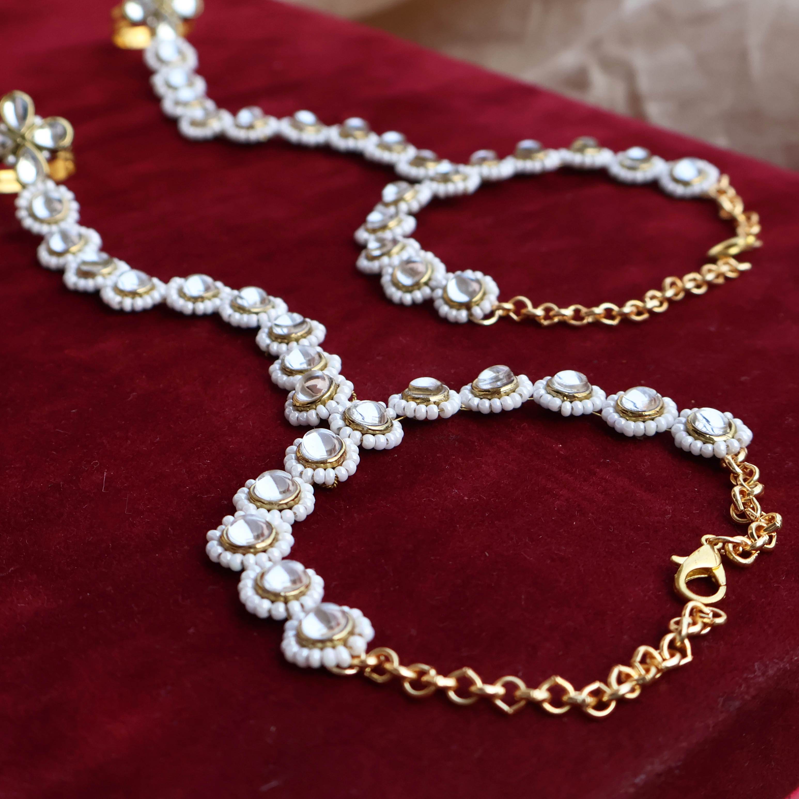 Regal Bridal Jewelry Set: Necklace, Maangtikka, Earrings, Hathphool, Anklet & Maangtikka - BeAbhika.com