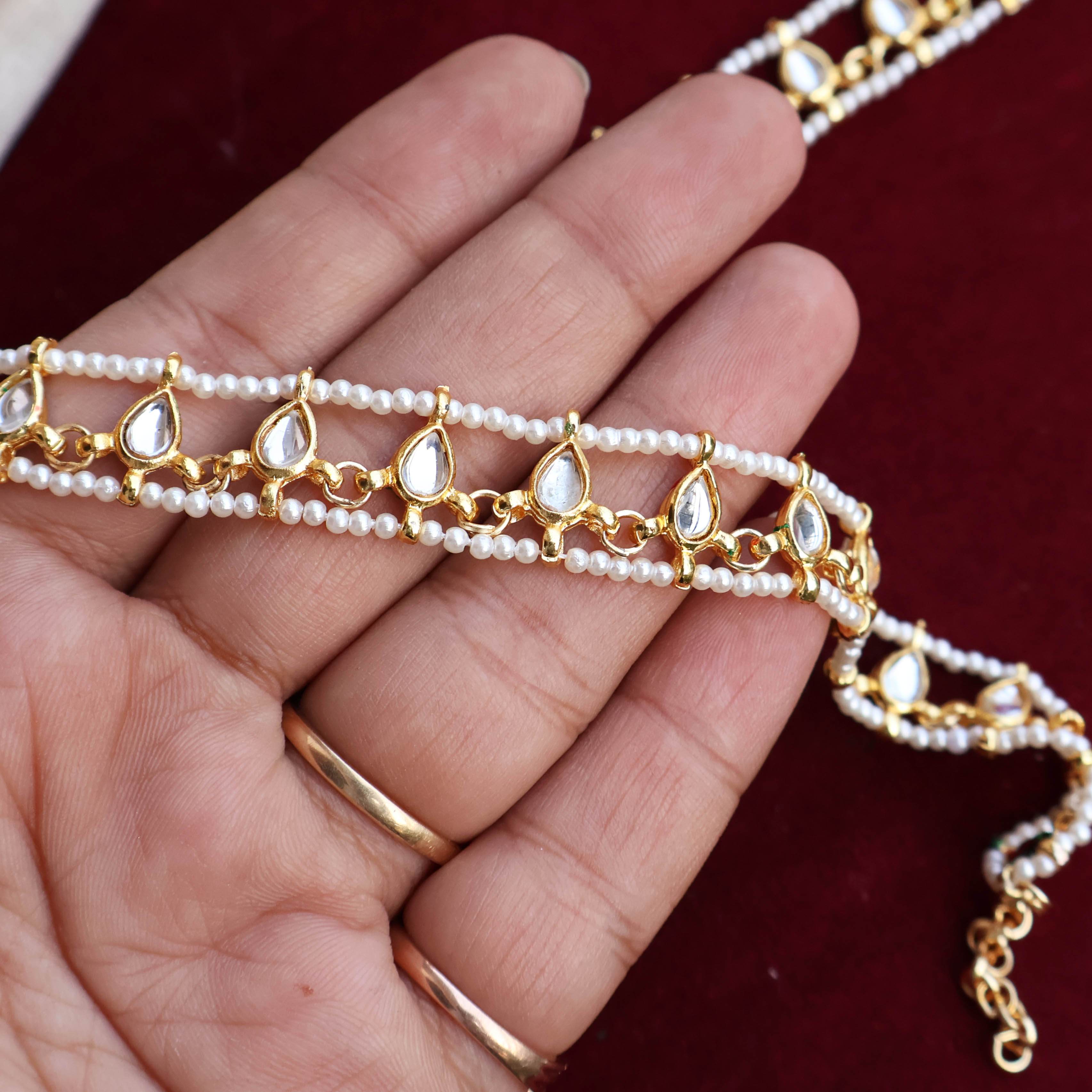 Regal Bridal Jewelry Set: Necklace, Maangtikka, Earrings, Hathphool, Anklet & Maangtikka - BeAbhika.com