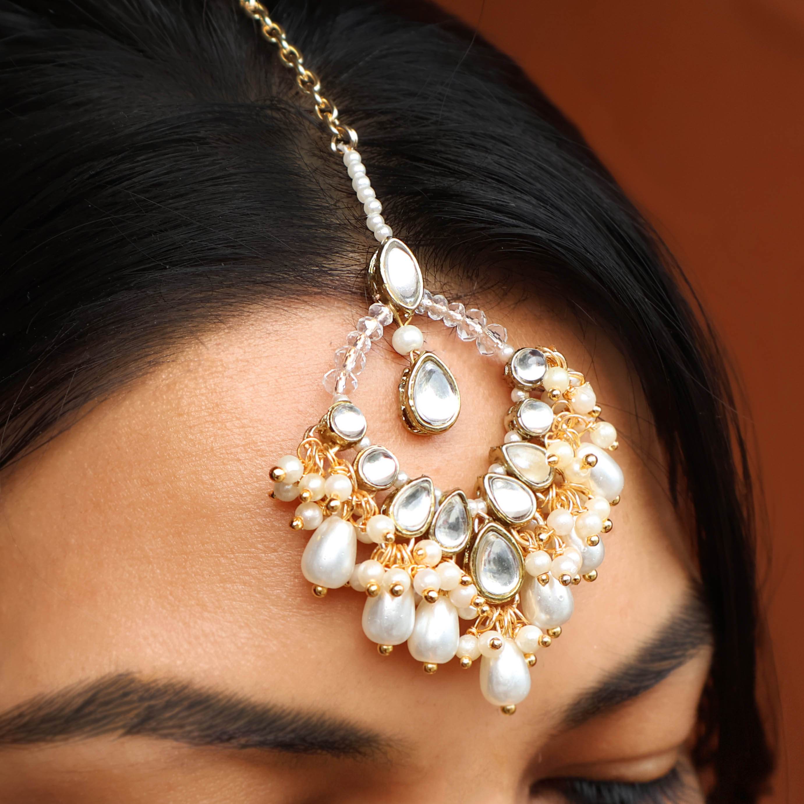 Regal Bridal Jewelry Set: Necklace, Maangtikka, Earrings, Hathphool, Anklet & Maangtikka - BeAbhika.com