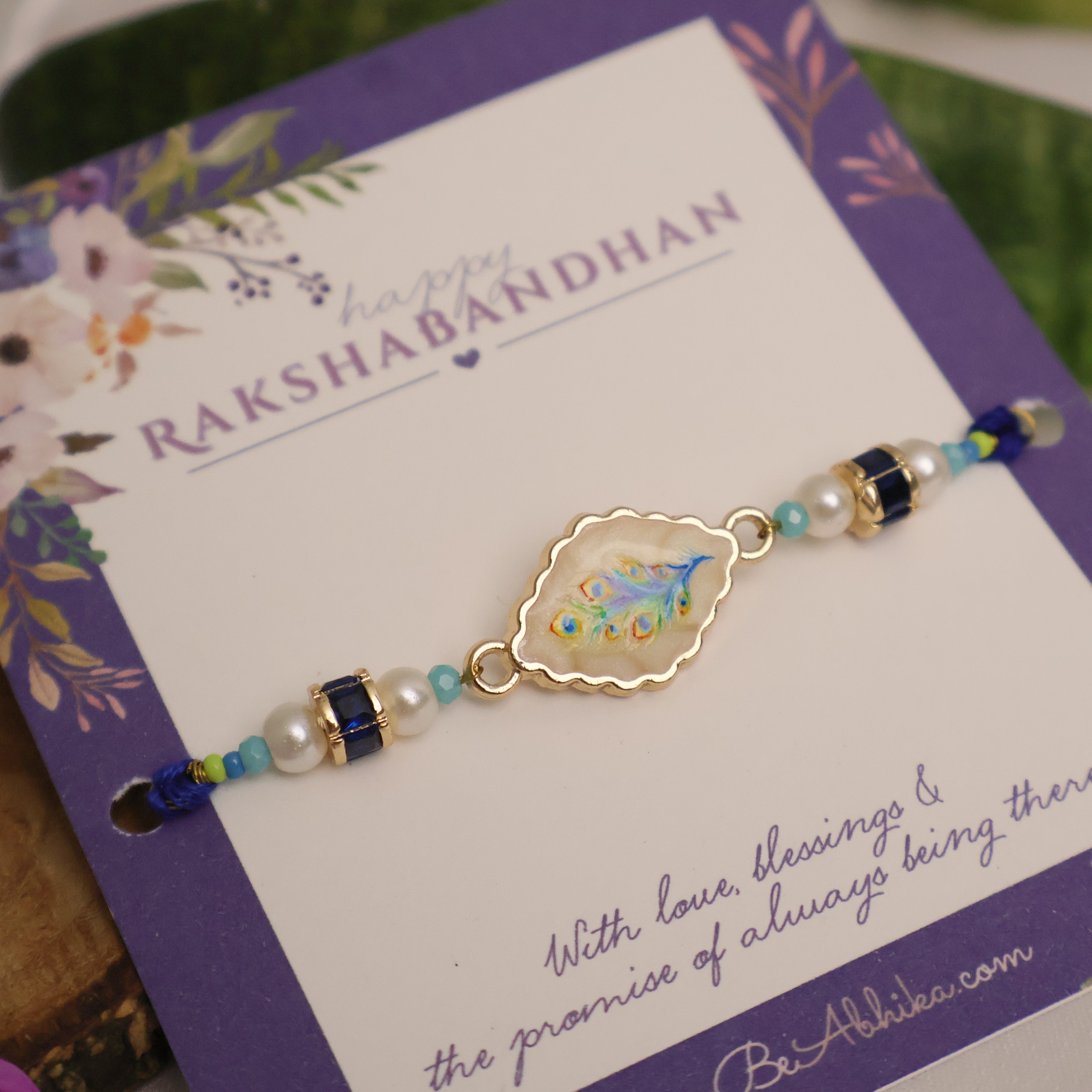 Blue Peacock Pearl Charm Rakhi