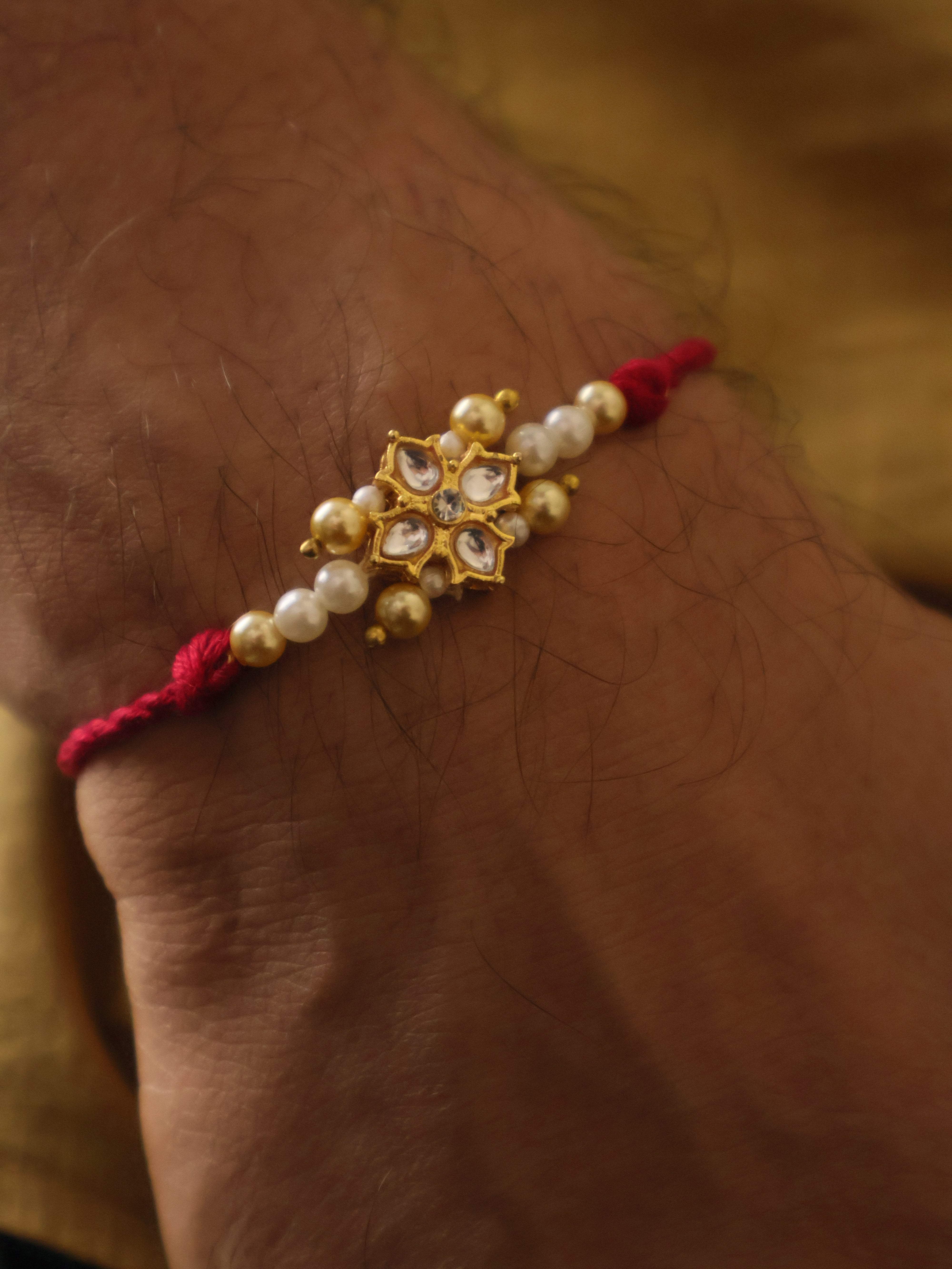 Kundan Floral Pearl Red Rakhi