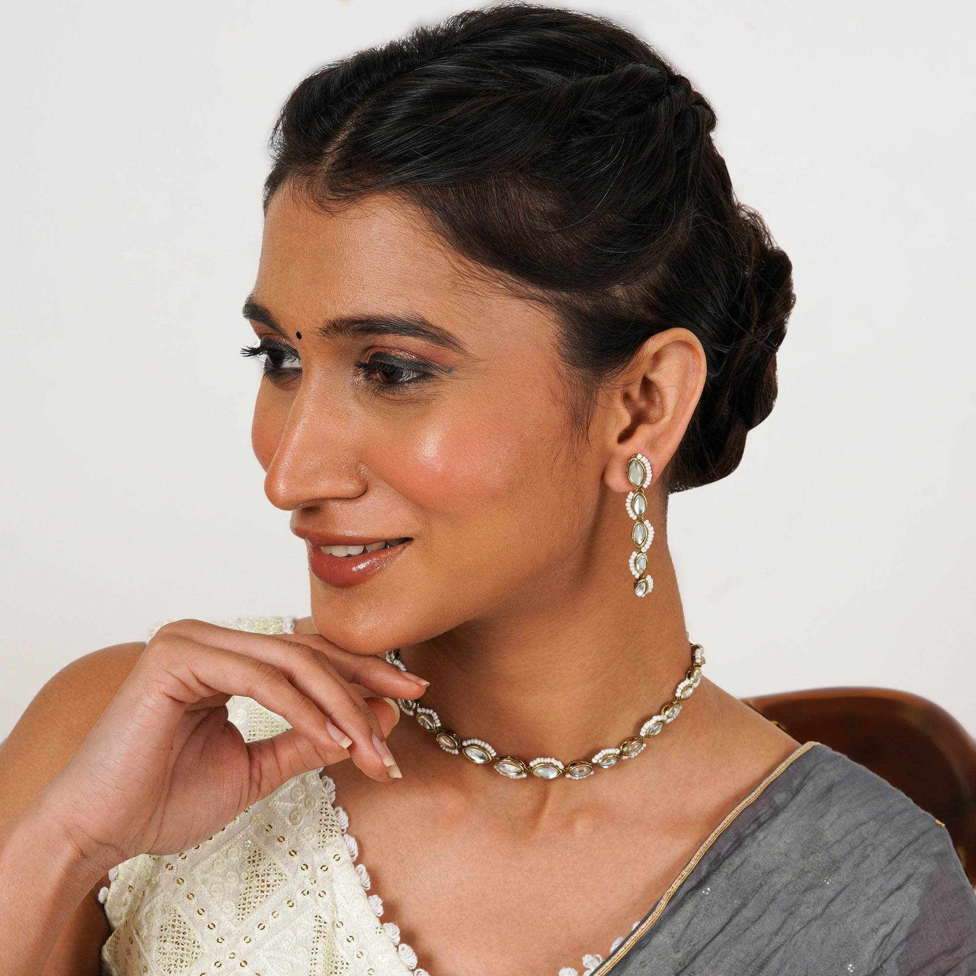 Kundan choker set in gold-tone with matching earrings and long bridal necklace, perfect for wedding functions , festive and bridal wear