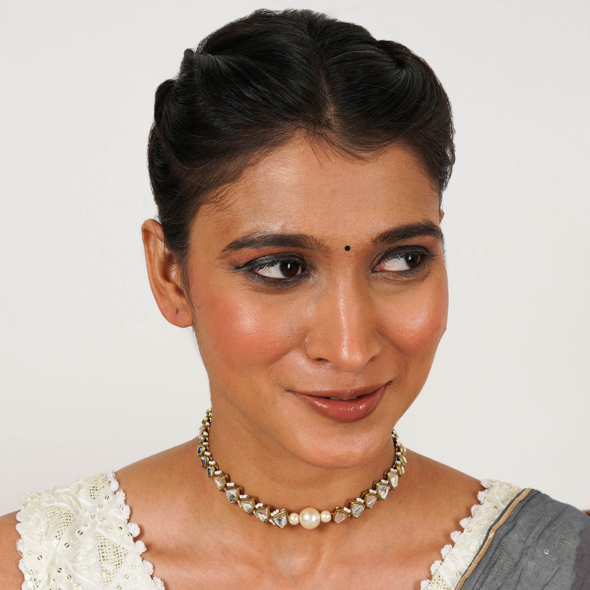 Kundan choker set in gold-tone with matching earrings and long bridal necklace, perfect for wedding functions , festive and bridal wear