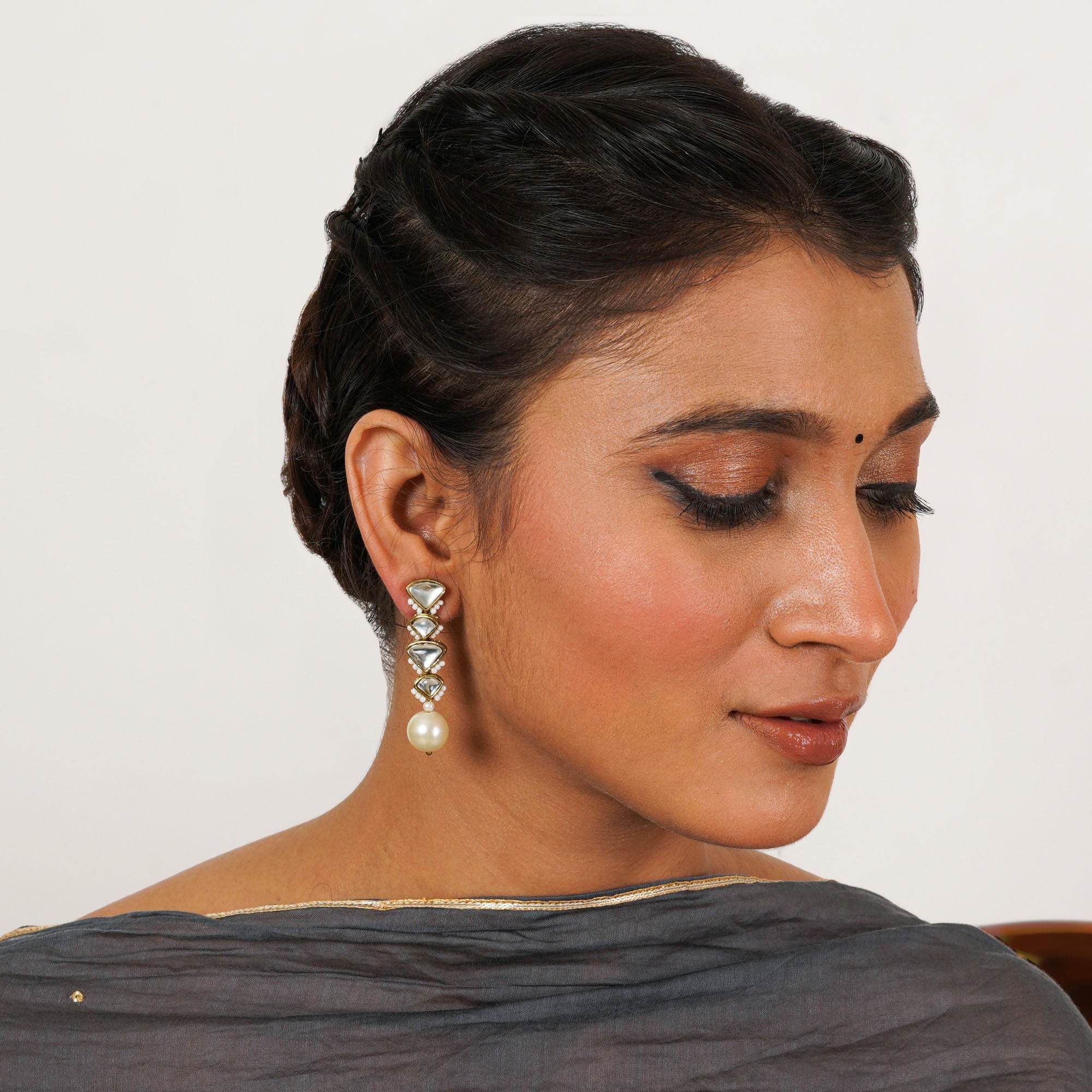 Traditional Kundan earrings in gold-tone, perfect for weddings and festive wear