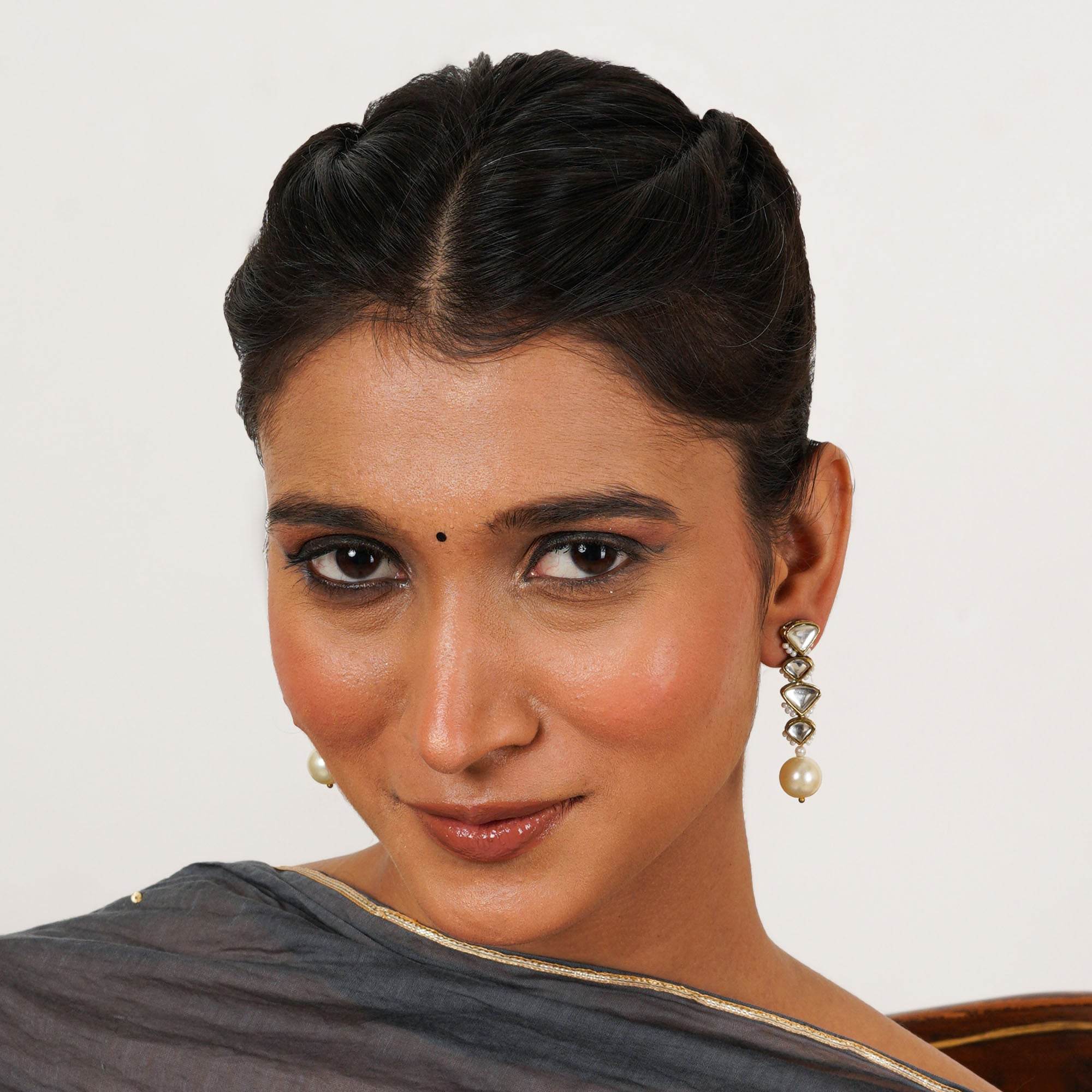 Traditional Kundan earrings in gold-tone, perfect for weddings and festive wear