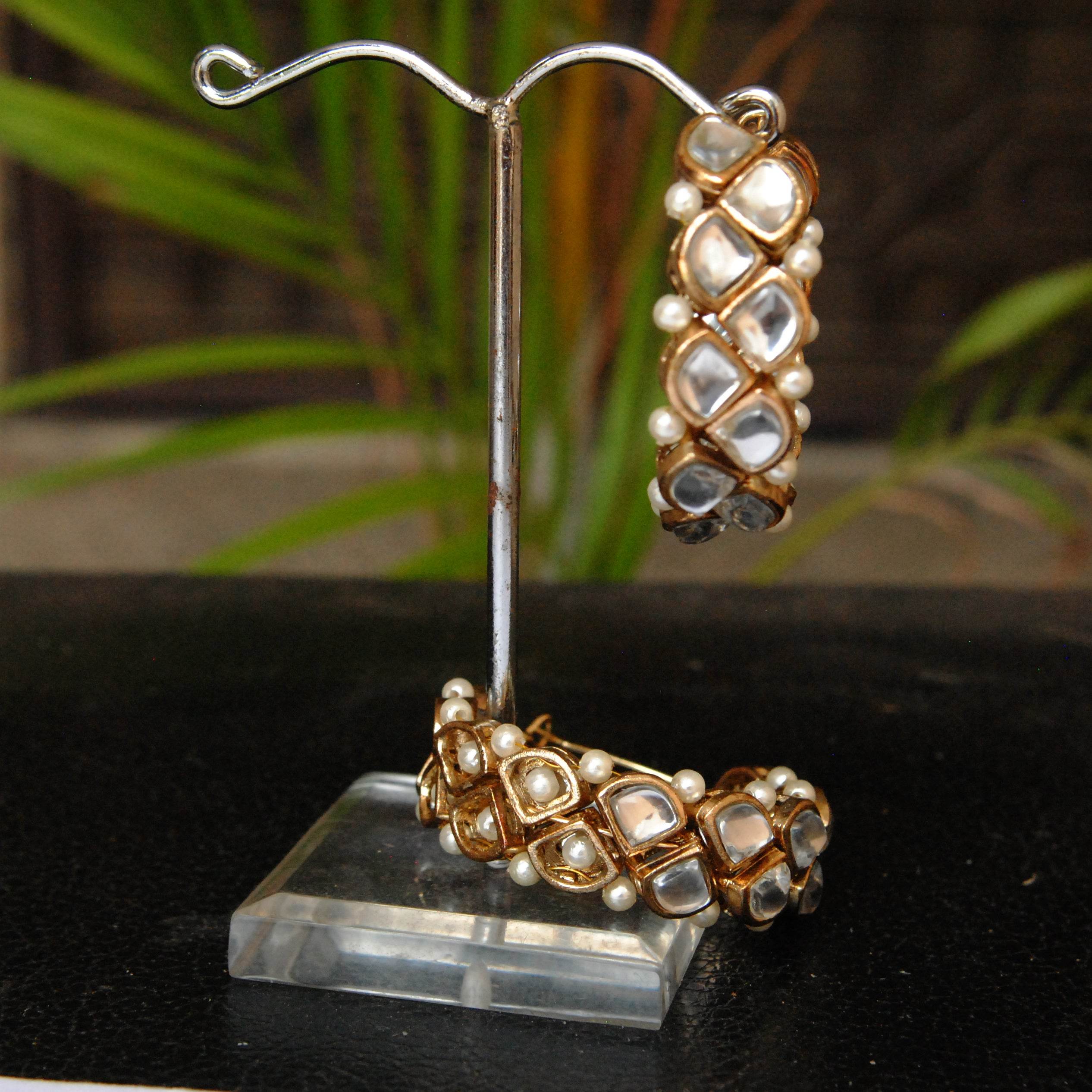 Traditional Kundan earrings in gold-tone, perfect for weddings and festive wear