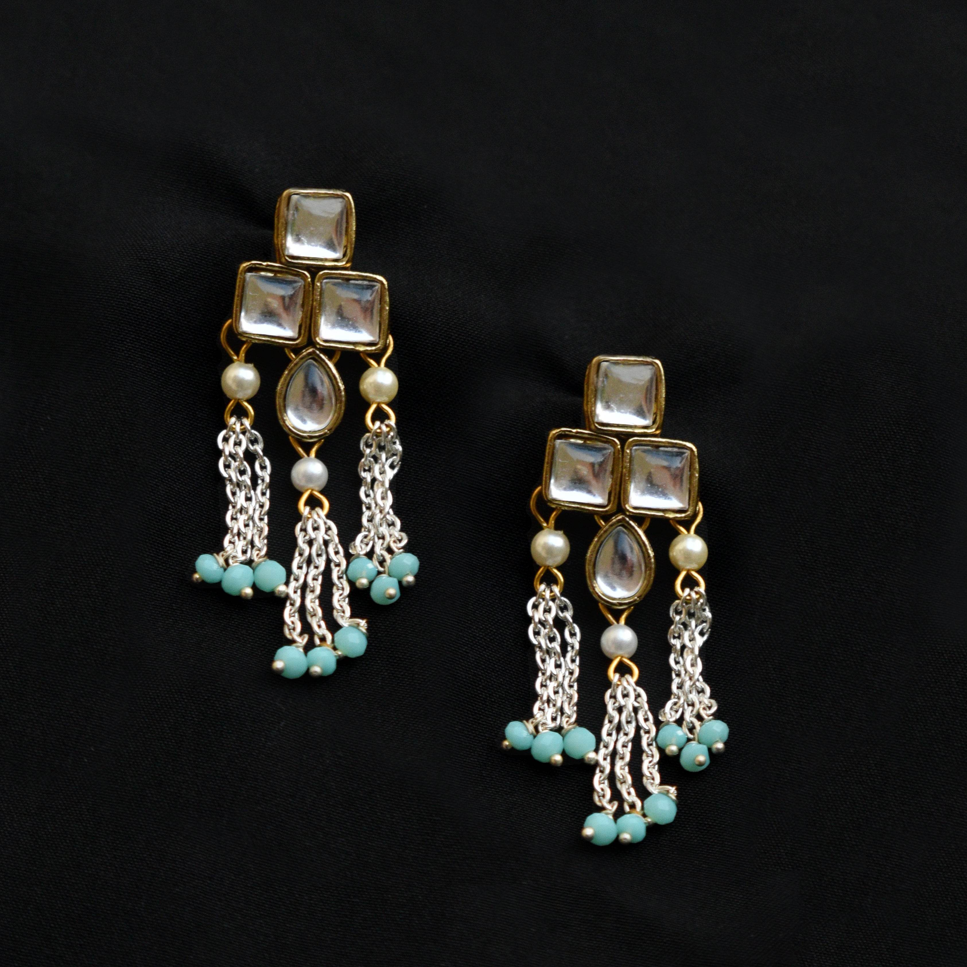 Traditional Kundan earrings in gold-tone, perfect for weddings and festive wear