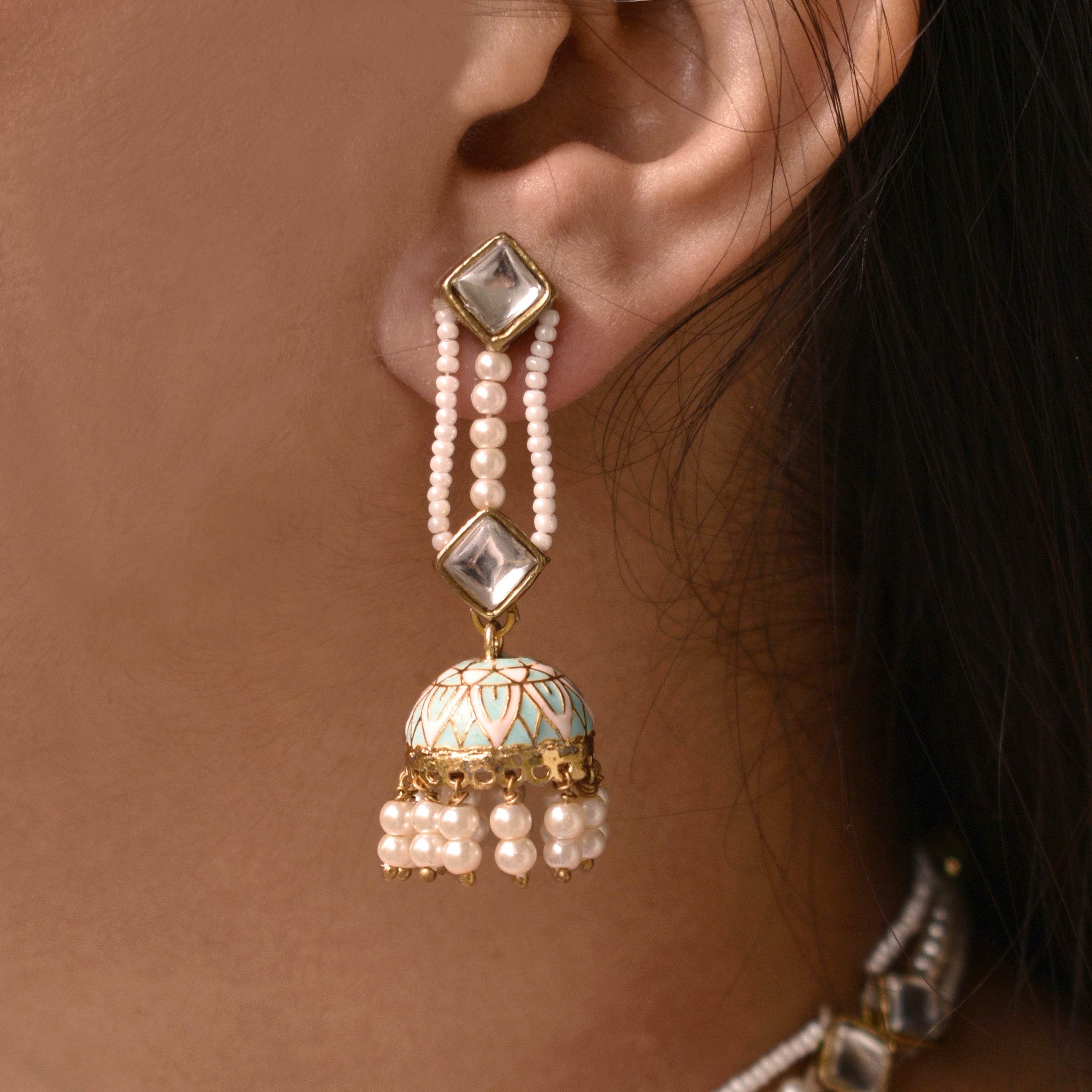 Traditional Kundan earrings in gold-tone, perfect for weddings and festive wear