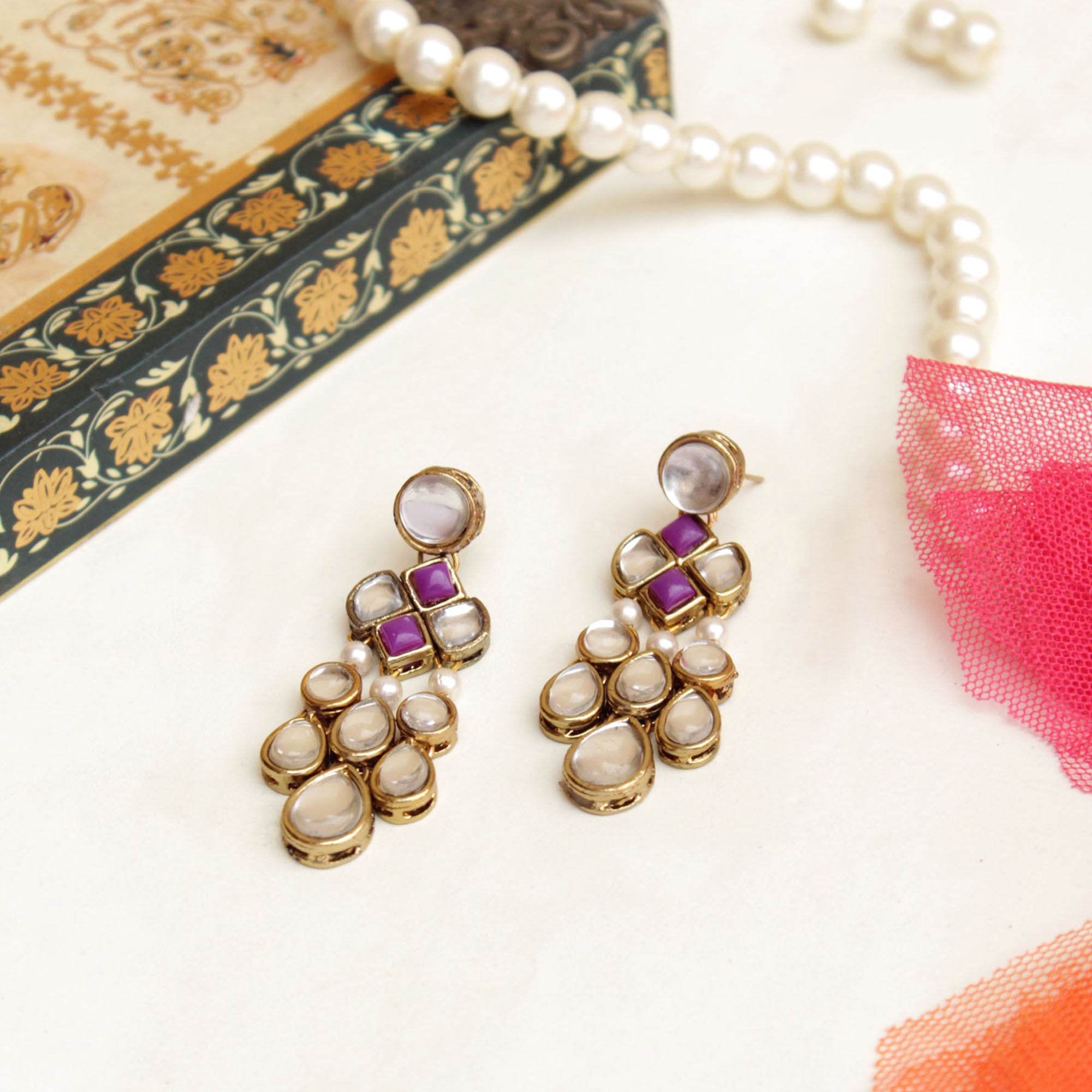 Traditional Kundan earrings in gold-tone, perfect for weddings and festive wear