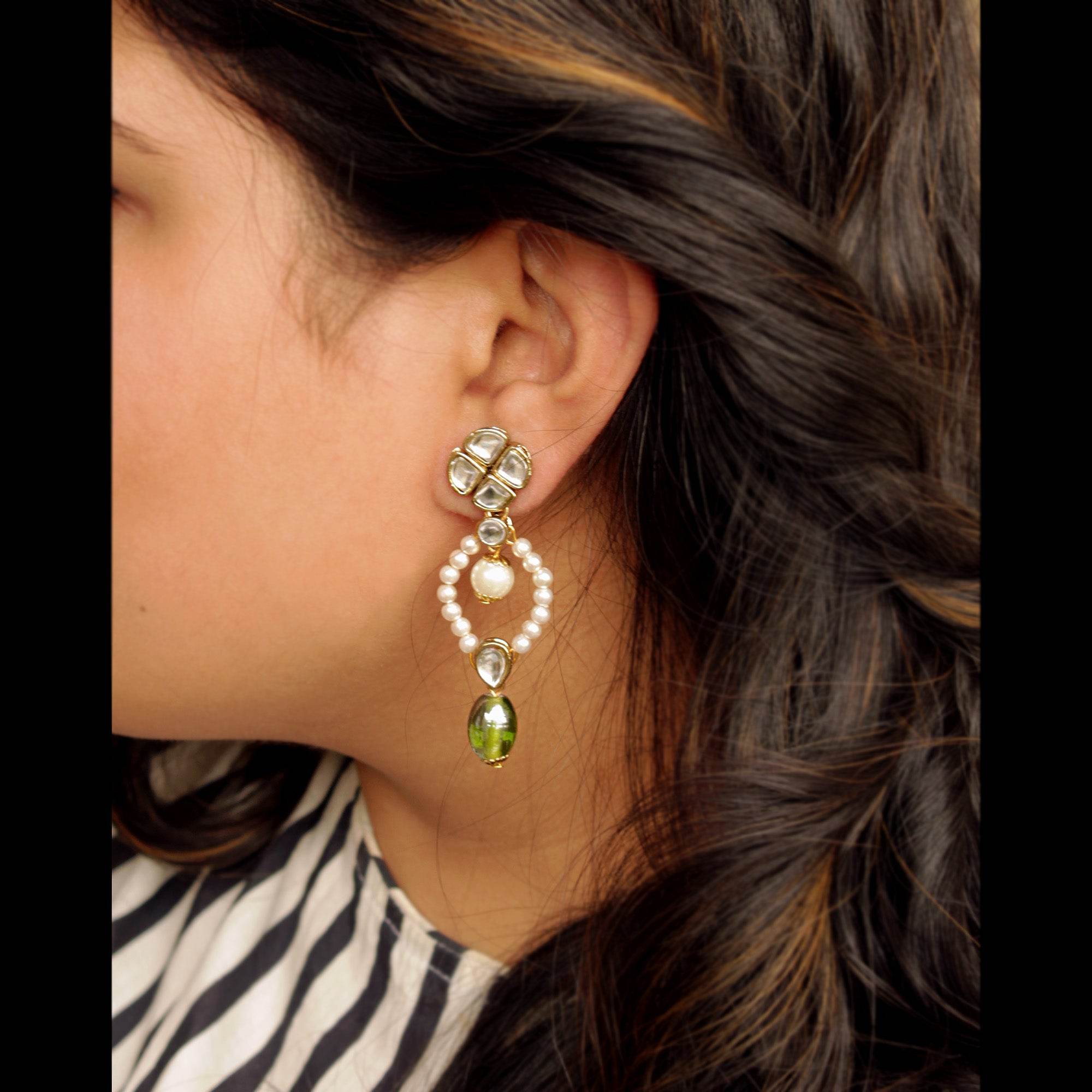 Traditional Kundan earrings in gold-tone, perfect for weddings and festive wear