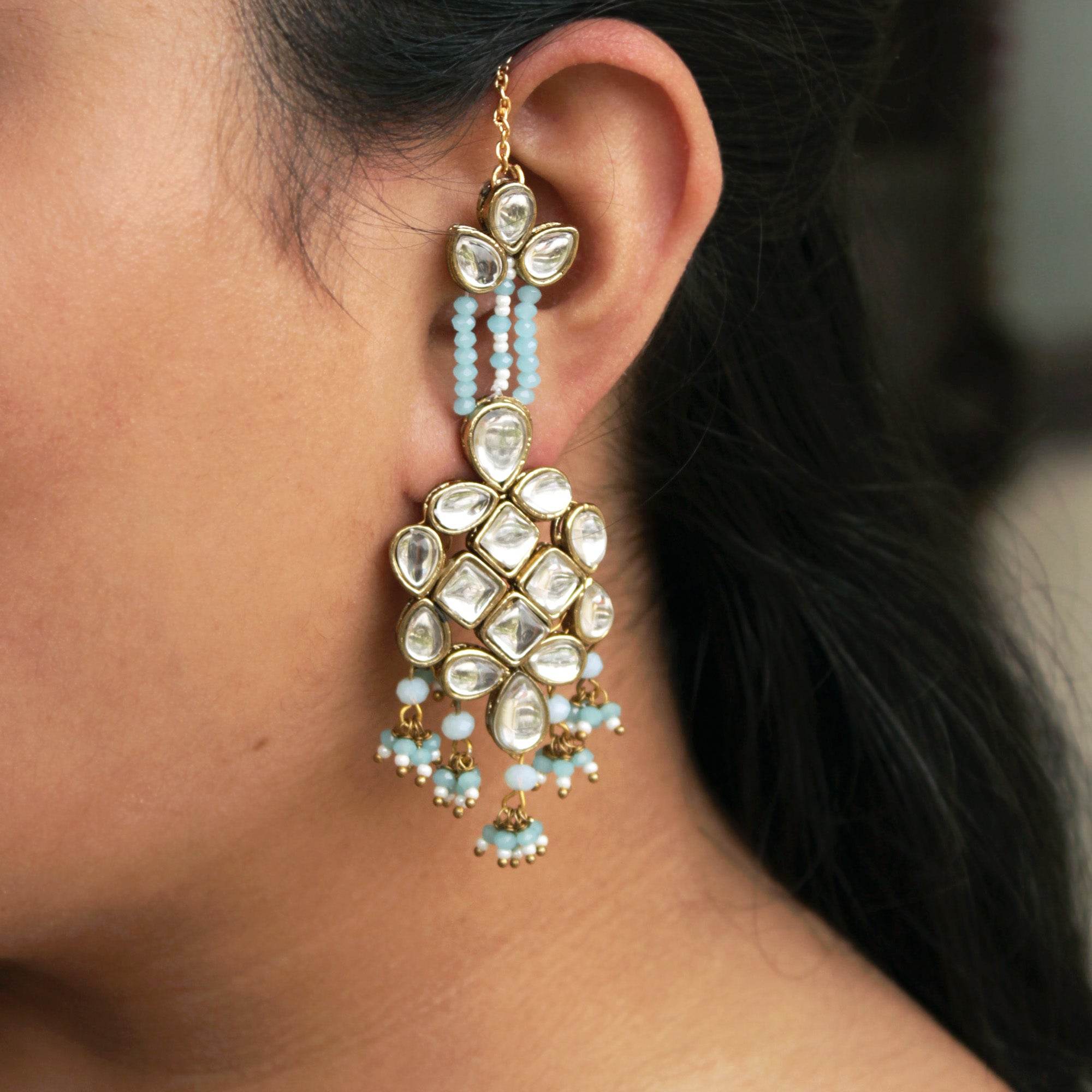 Traditional Kundan earrings in gold-tone, perfect for weddings and festive wear