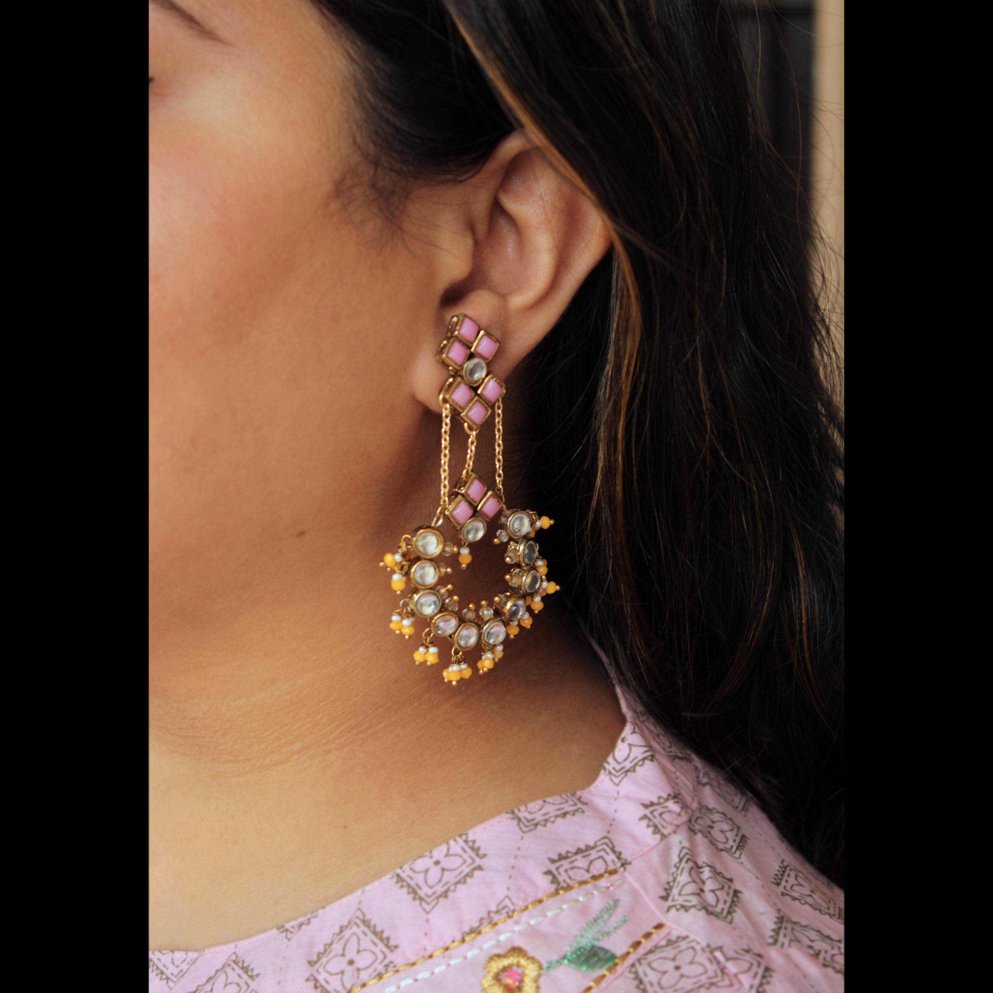 Traditional Kundan earrings in gold-tone, perfect for weddings and festive wear
