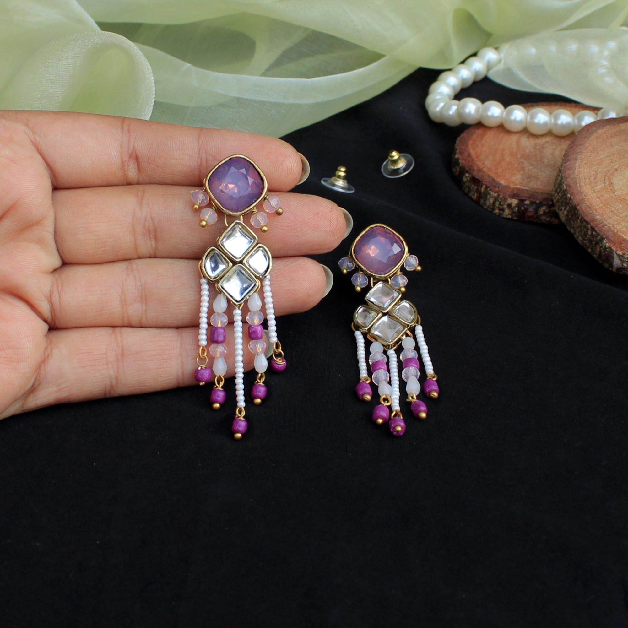 Traditional Kundan earrings in gold-tone, perfect for weddings and festive wear