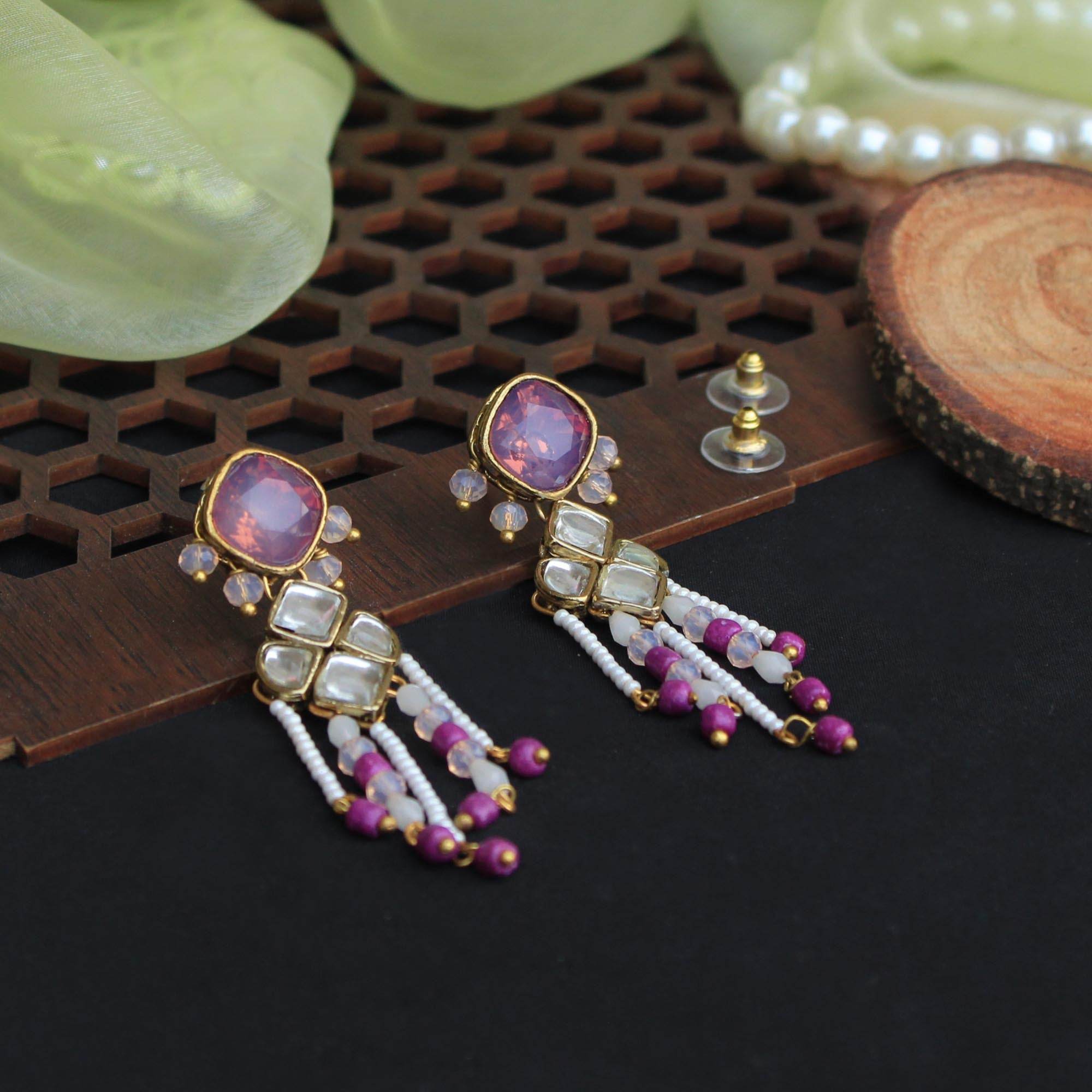 Traditional Kundan earrings in gold-tone, perfect for weddings and festive wear