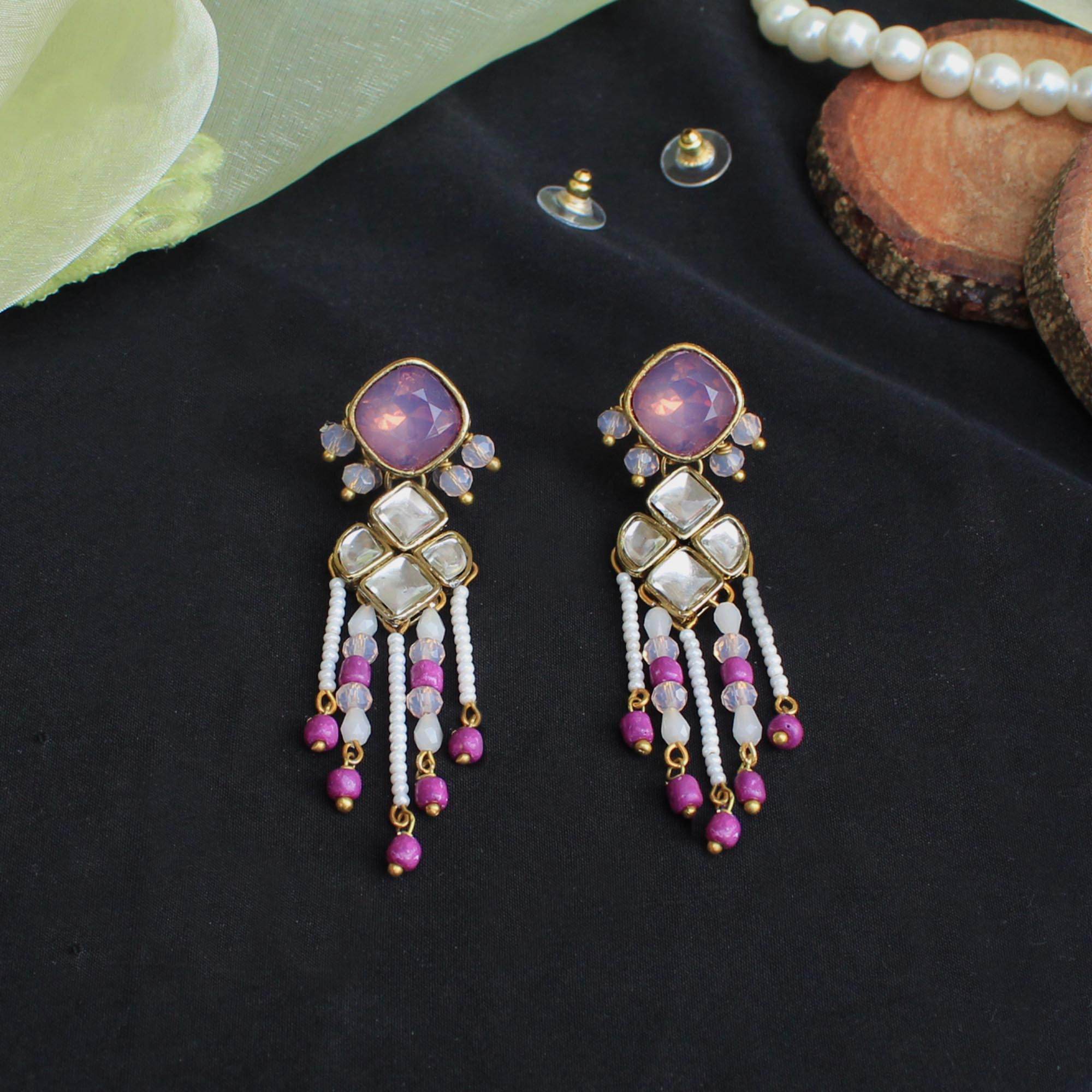 Traditional Kundan earrings in gold-tone, perfect for weddings and festive wear