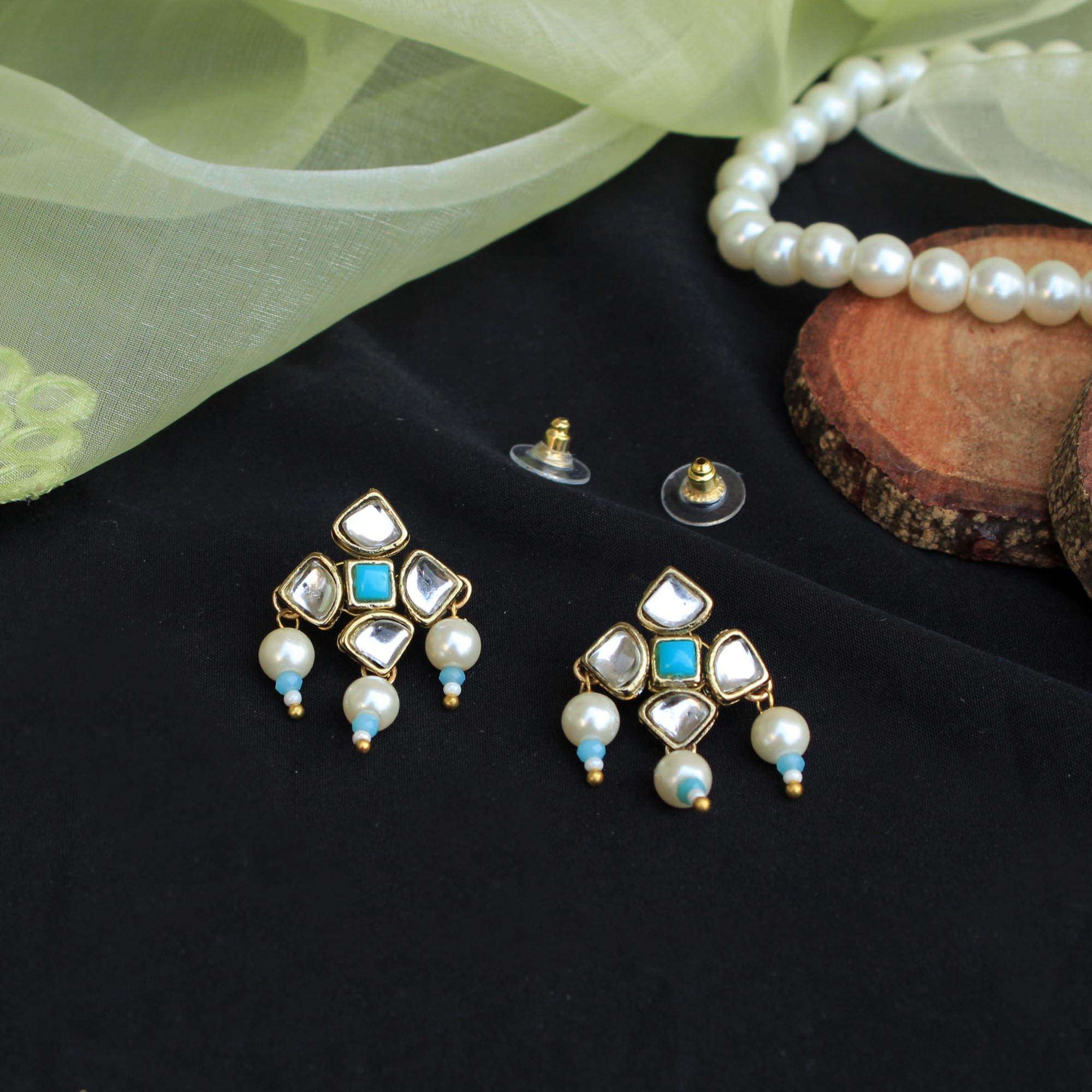 Traditional Kundan earrings in gold-tone, perfect for weddings and festive wear