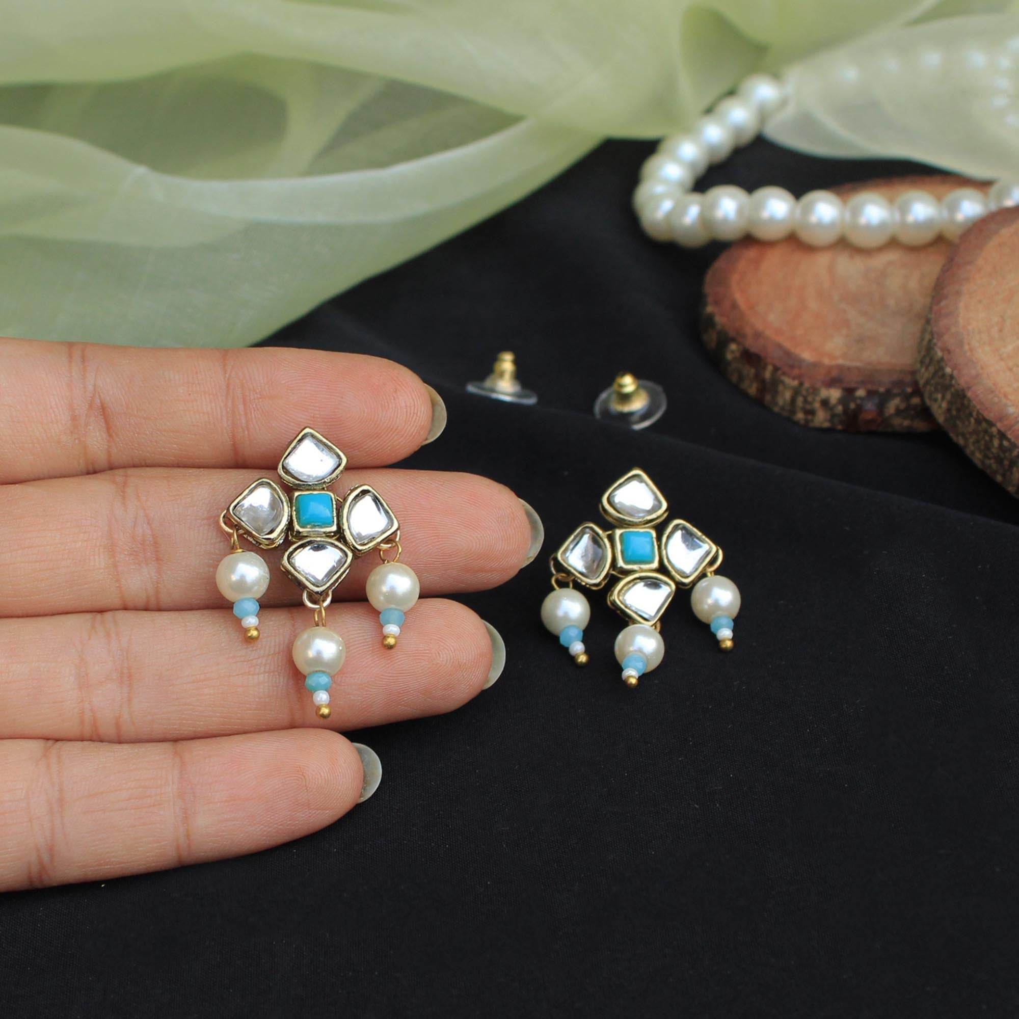 Traditional Kundan earrings in gold-tone, perfect for weddings and festive wear