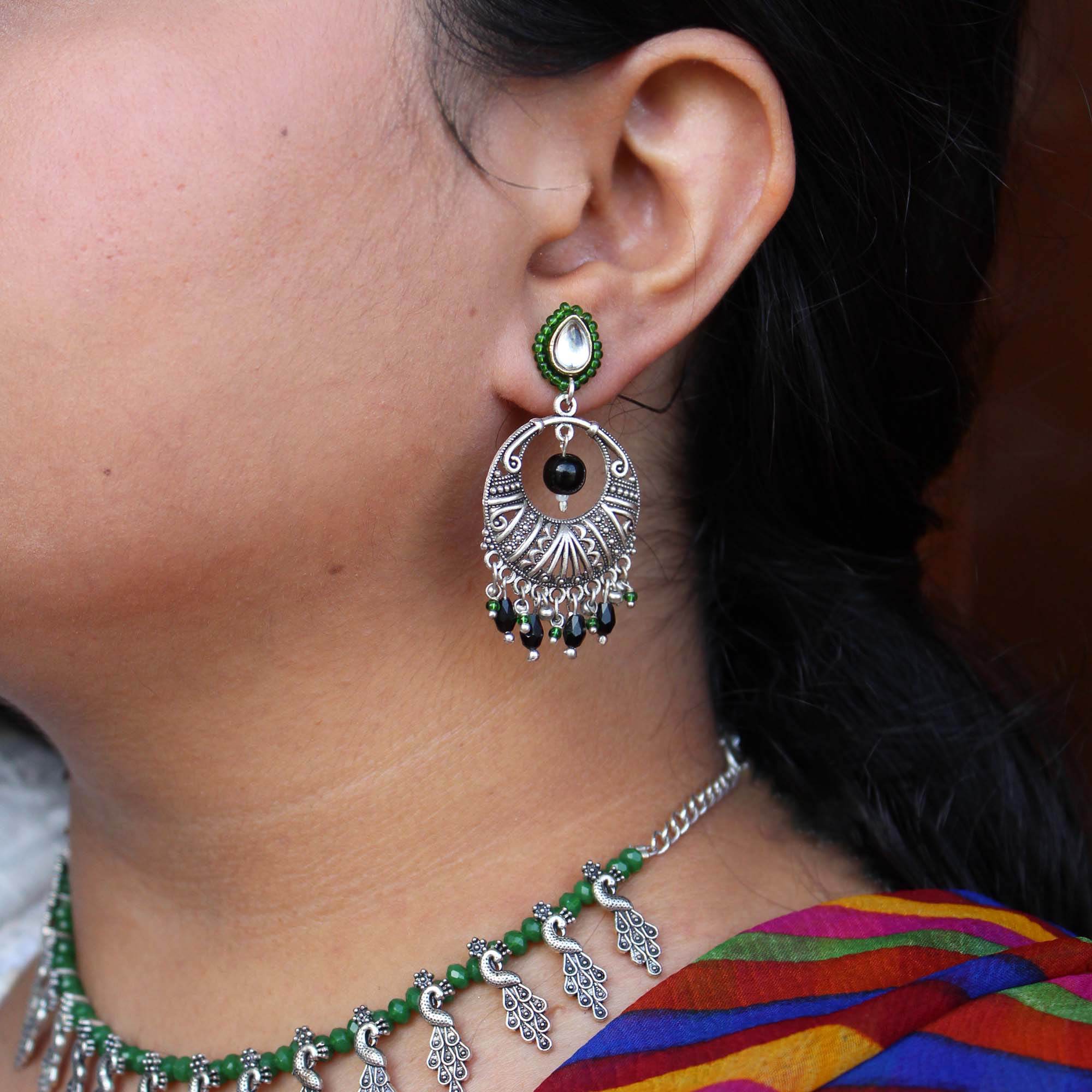 Traditional Kundan earrings in gold-tone, perfect for weddings and festive wear
