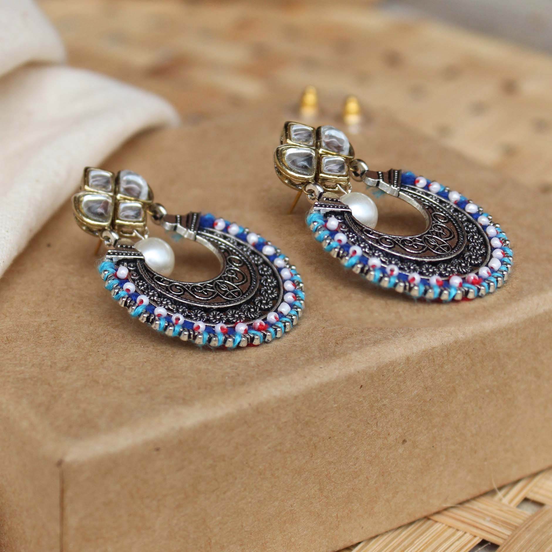 Traditional Kundan earrings in gold-tone, perfect for weddings and festive wear