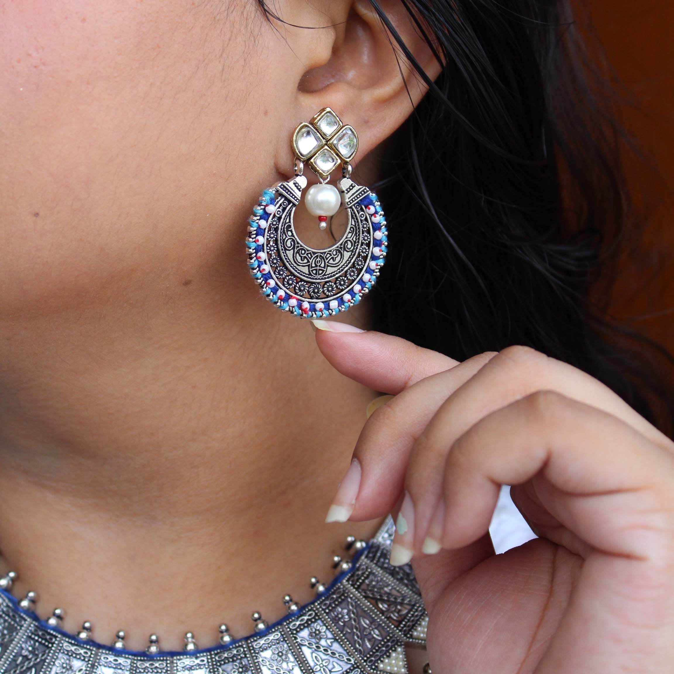 Traditional Kundan earrings in gold-tone, perfect for weddings and festive wear