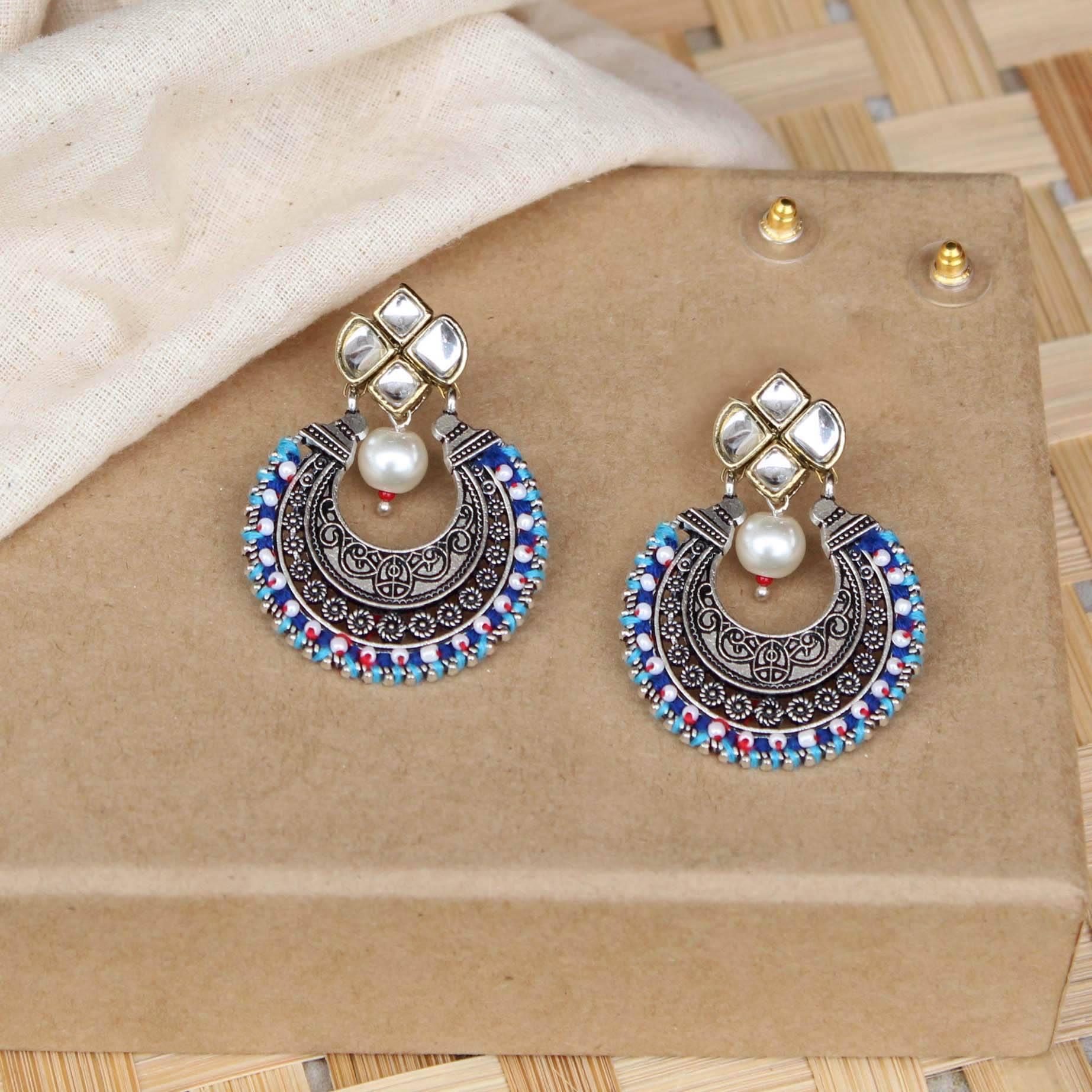 Traditional Kundan earrings in gold-tone, perfect for weddings and festive wear