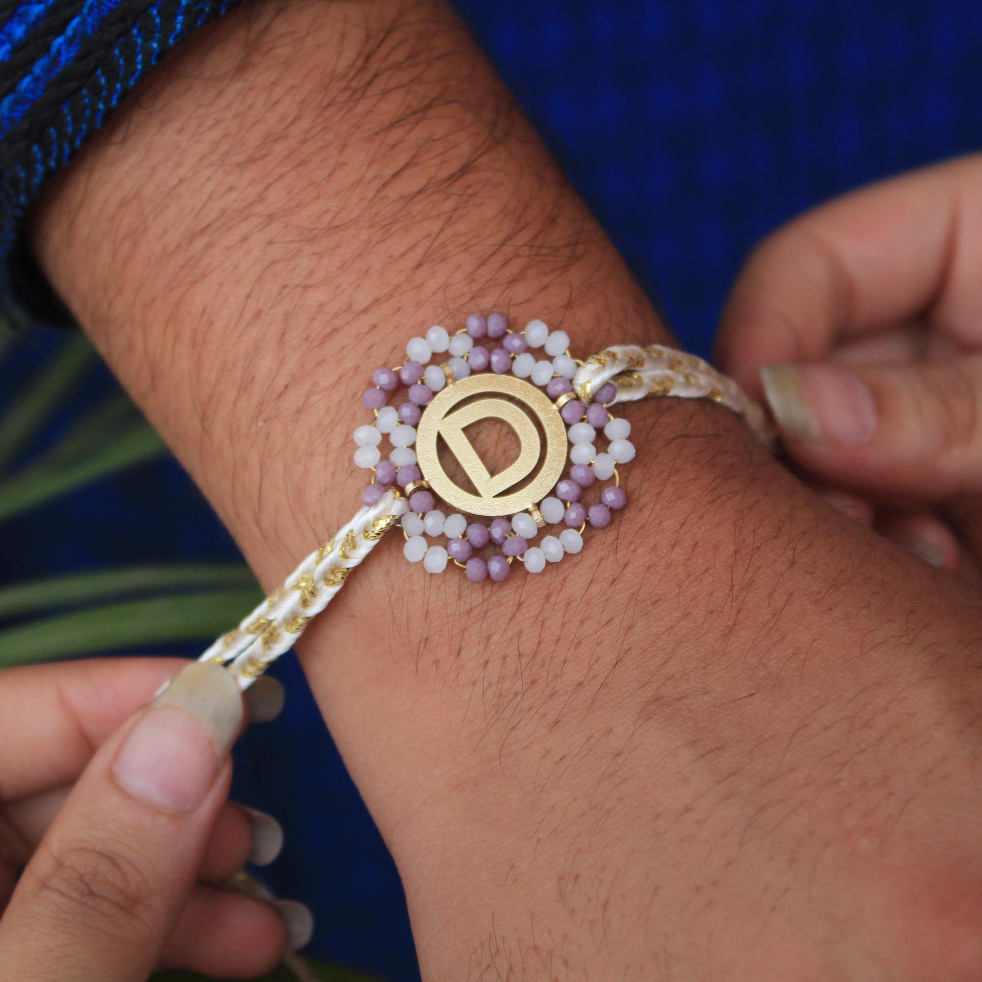 BeAbhika Purple Beads Gold Tone Personalised Name Initial Rakhi Customised Name Letter Alphabet Rakhi Lightweight Easy To Tie Rakhi Available At Best Price In India Online COD Available Send Rakhi To Brother Small Brother Big Brother Younger Brother Send Rakhi Abroad With Roli Chawal Capsules Designer Unqiue Famous