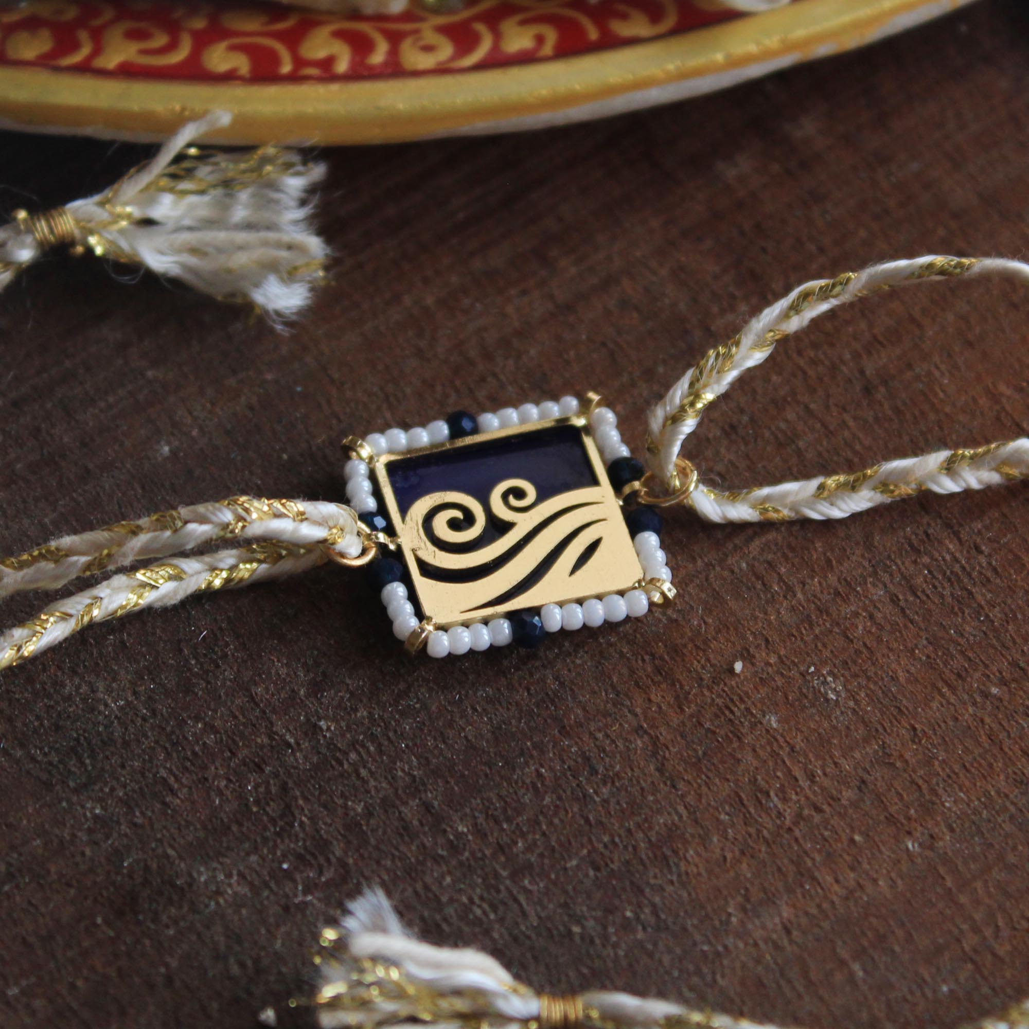 BeAbhika Gold Tone Water Beach Waves Nature Inspired Rakhi Blue Acrylic Designer Unqiue Famous Rakhi Lightweight Easy To Tie Rakhi Available At Best Price In India Online COD Available Send Rakhi To Brother Small Brother Big Brother Younger Brother Send Rakhi Abroad With Roli Chawal Capsules