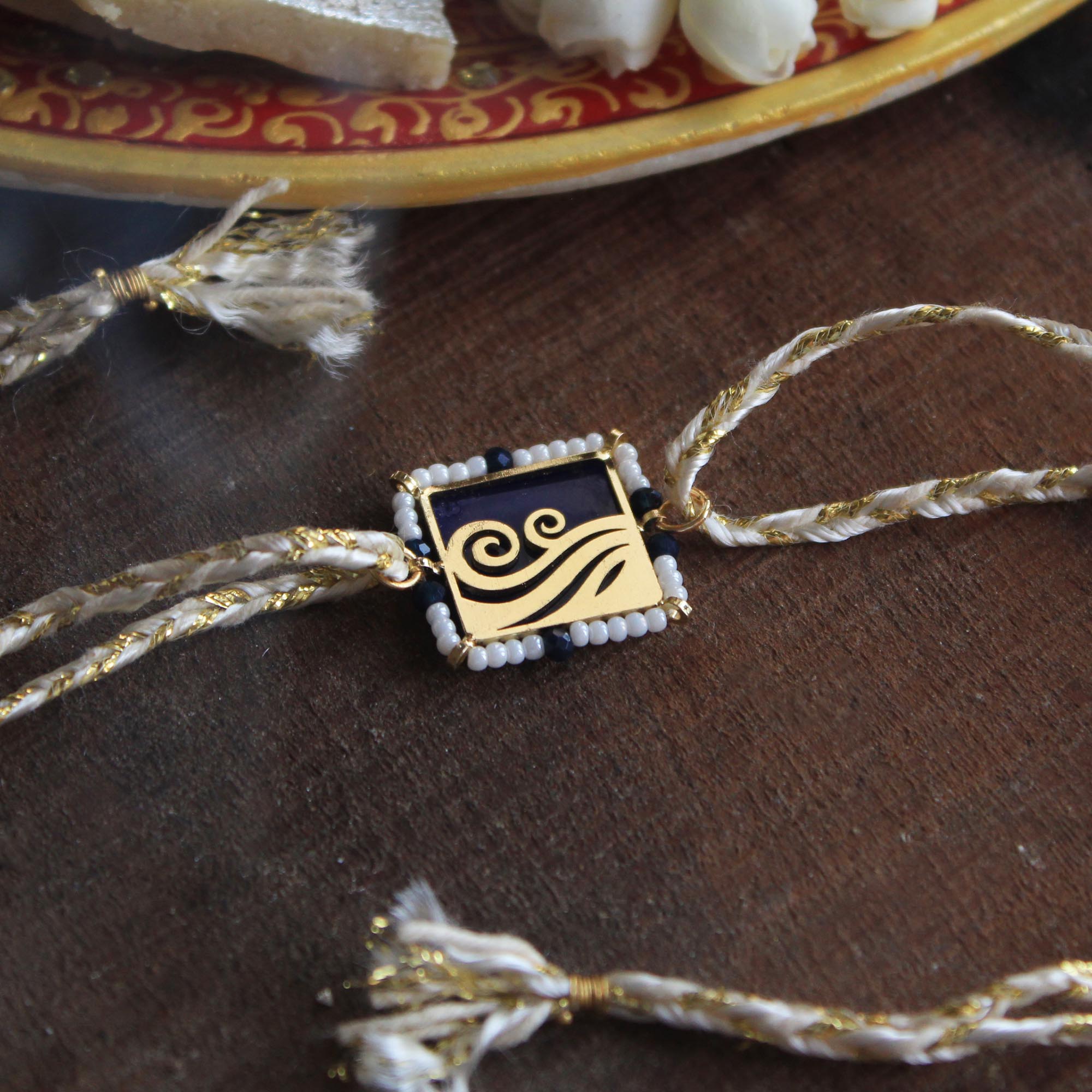 BeAbhika Gold Tone Water Beach Waves Nature Inspired Rakhi Blue Acrylic Designer Unqiue Famous Rakhi Lightweight Easy To Tie Rakhi Available At Best Price In India Online COD Available Send Rakhi To Brother Small Brother Big Brother Younger Brother Send Rakhi Abroad With Roli Chawal Capsules
