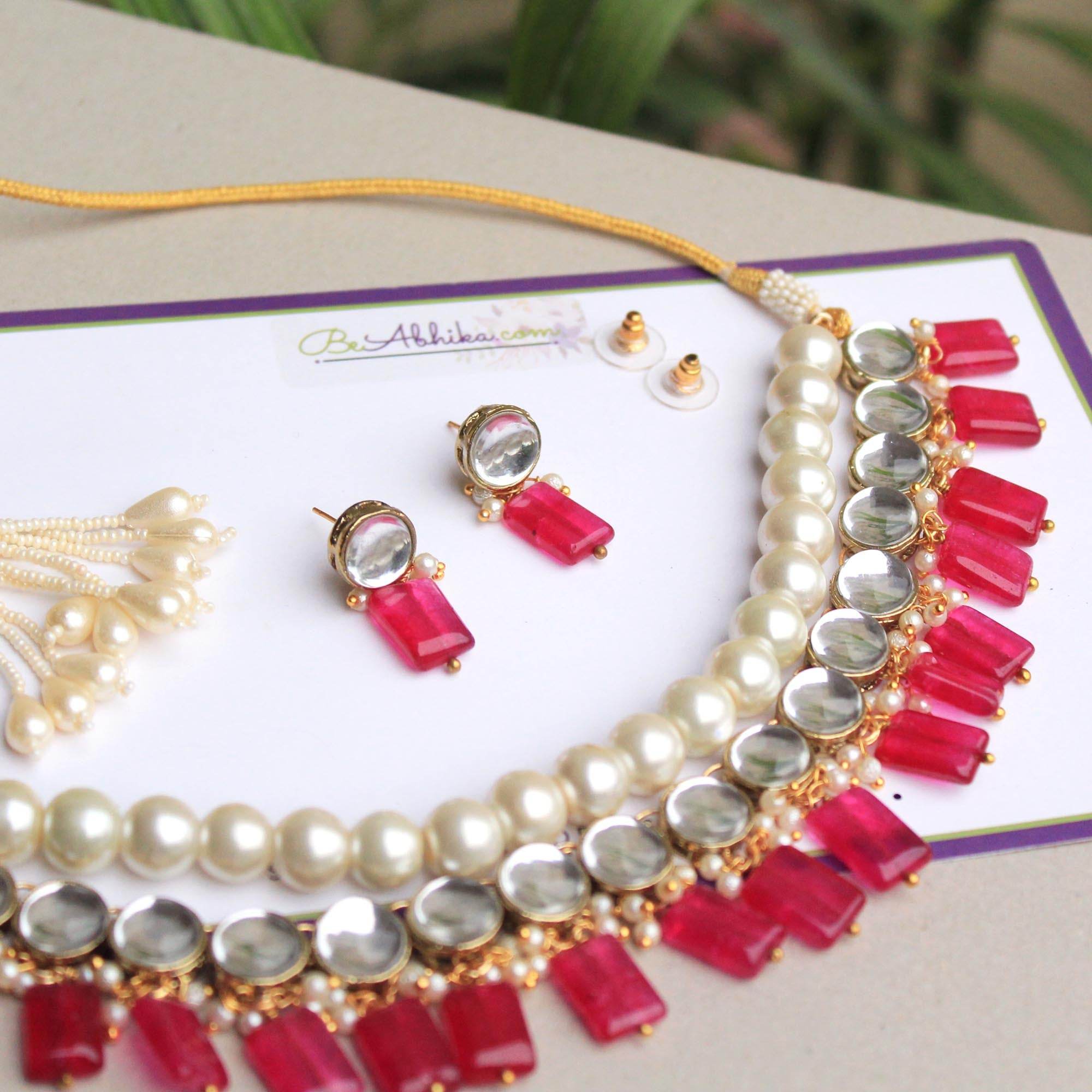 Kundan choker set in gold-tone with matching earrings and long bridal necklace, perfect for wedding functions , festive and bridal wear