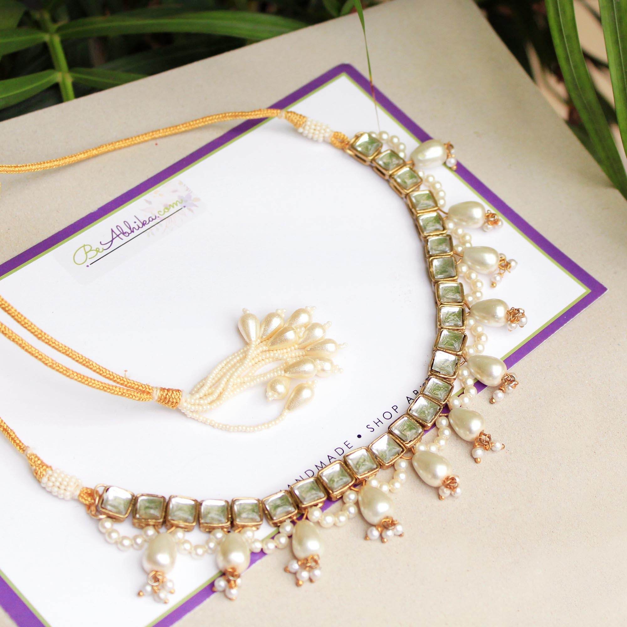 Kundan choker set in gold-tone with matching earrings and long bridal necklace, perfect for wedding functions , festive and bridal wear