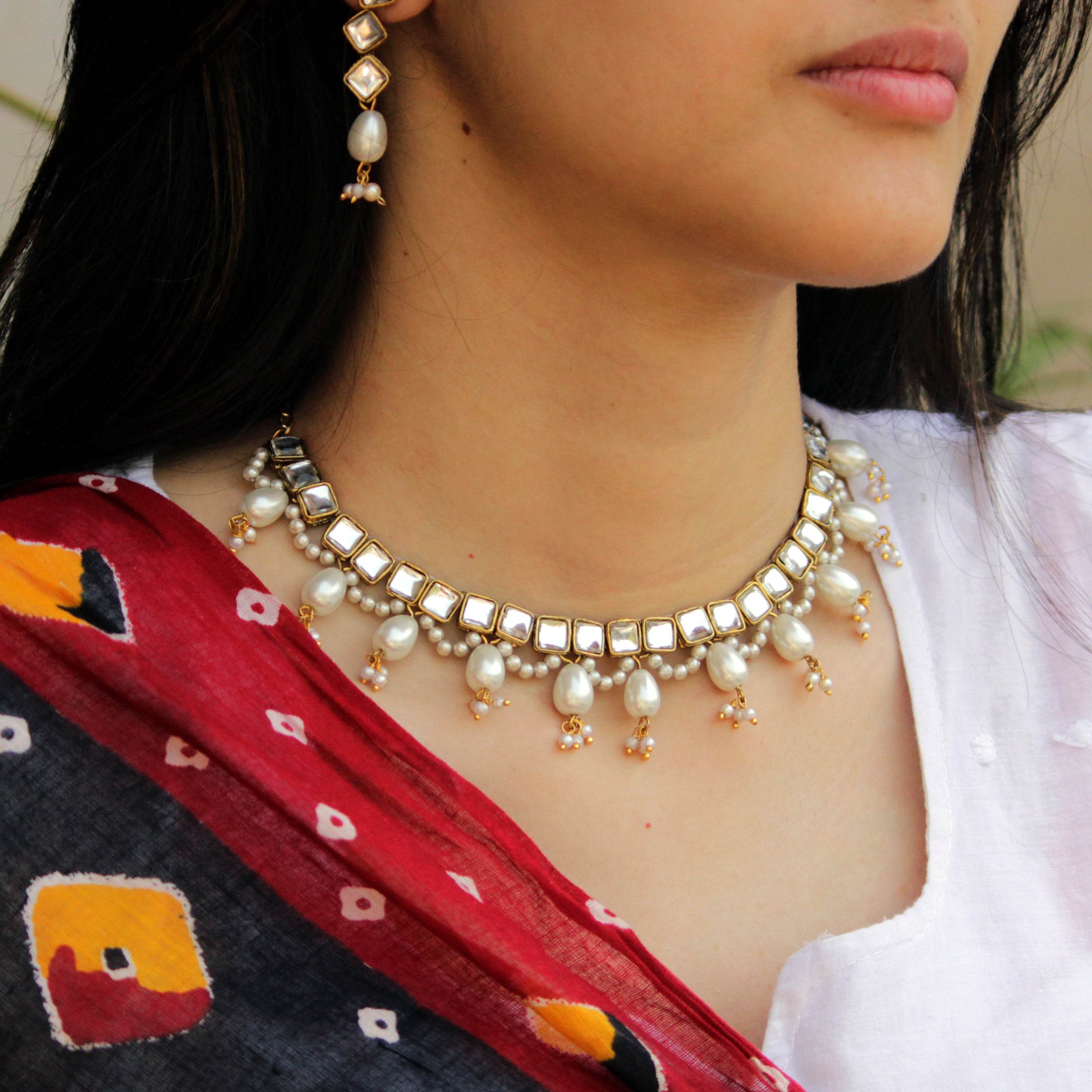 Kundan choker set in gold-tone with matching earrings and long bridal necklace, perfect for wedding functions , festive and bridal wear
