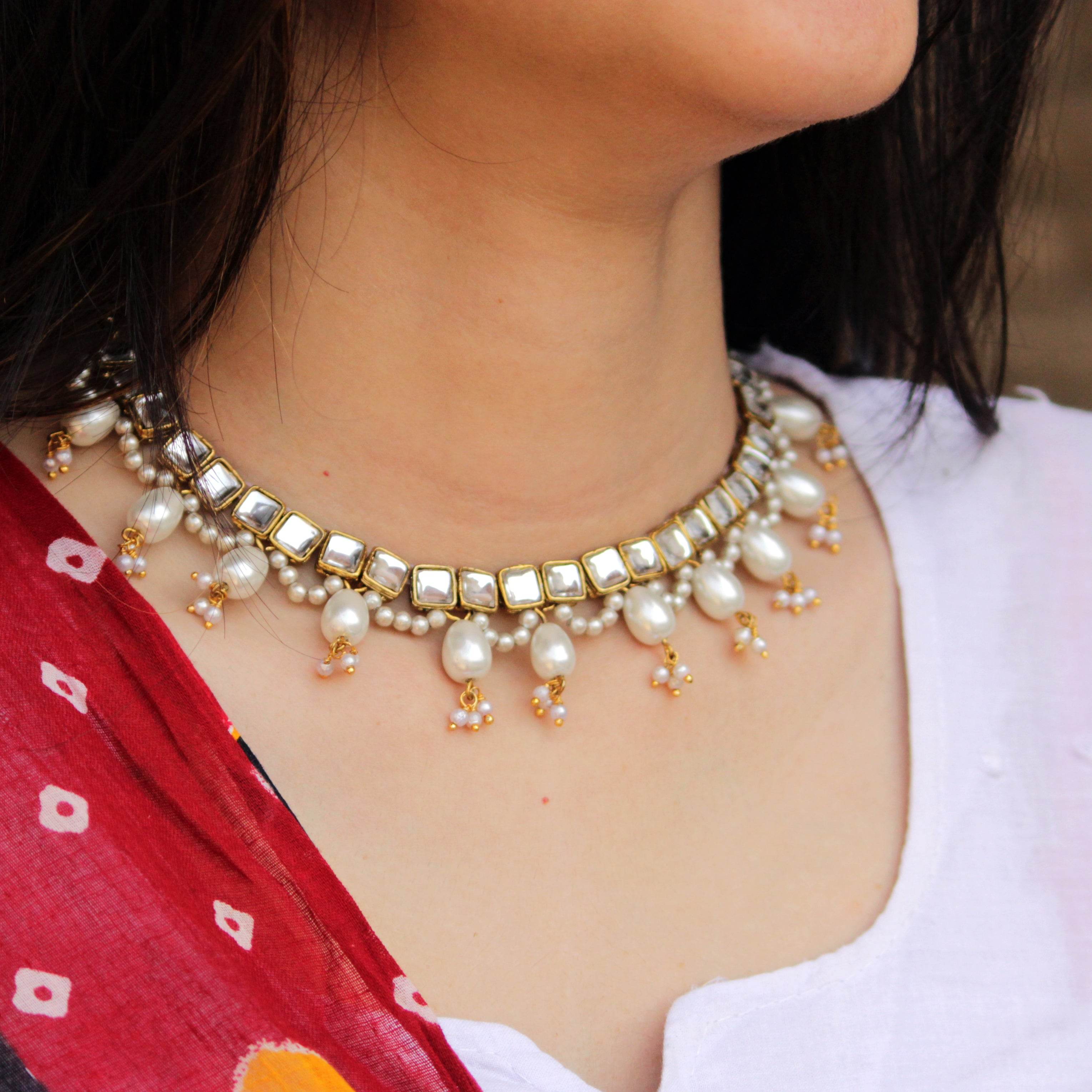 Kundan choker set in gold-tone with matching earrings and long bridal necklace, perfect for wedding functions , festive and bridal wear