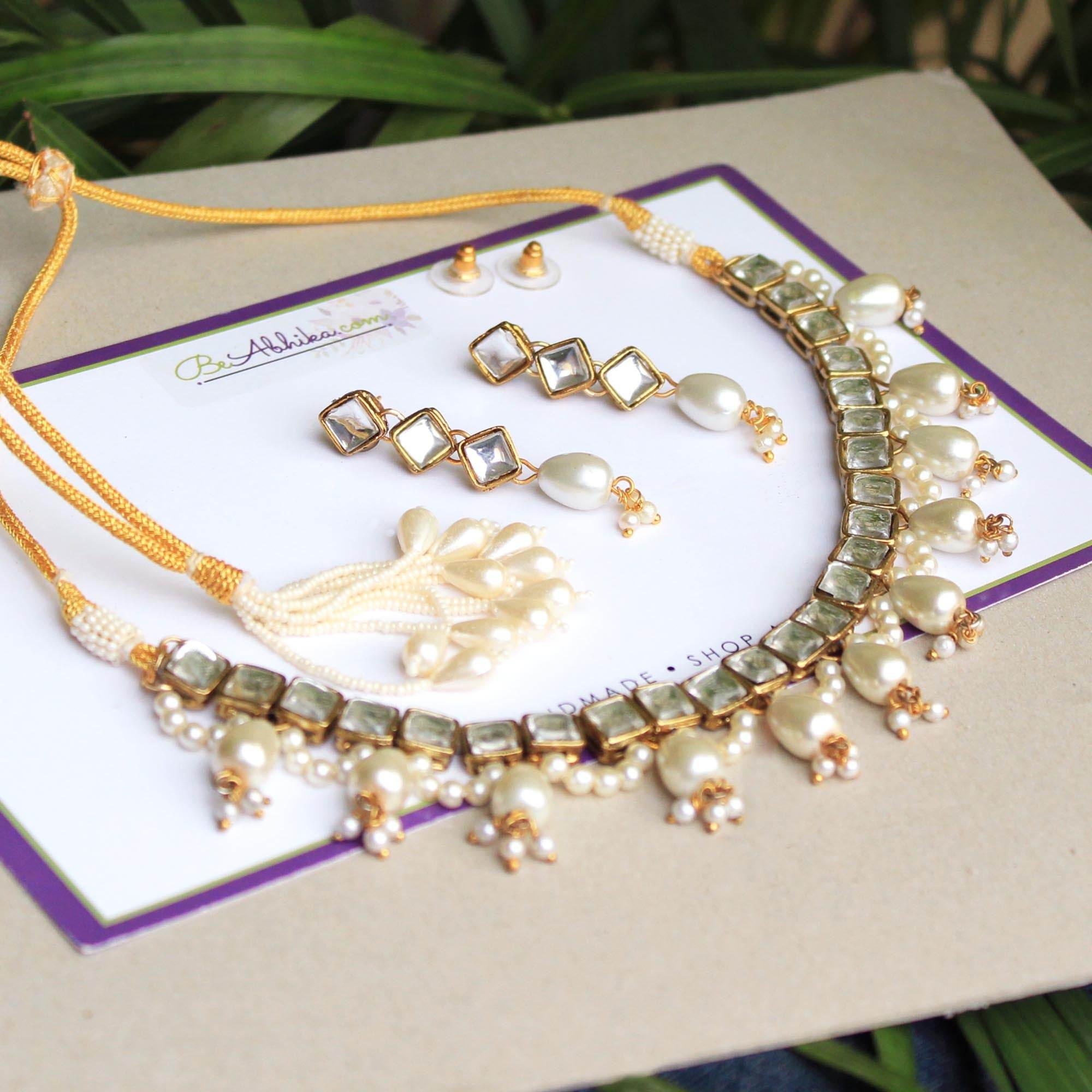 Kundan choker set in gold-tone with matching earrings and long bridal necklace, perfect for wedding functions , festive and bridal wear
