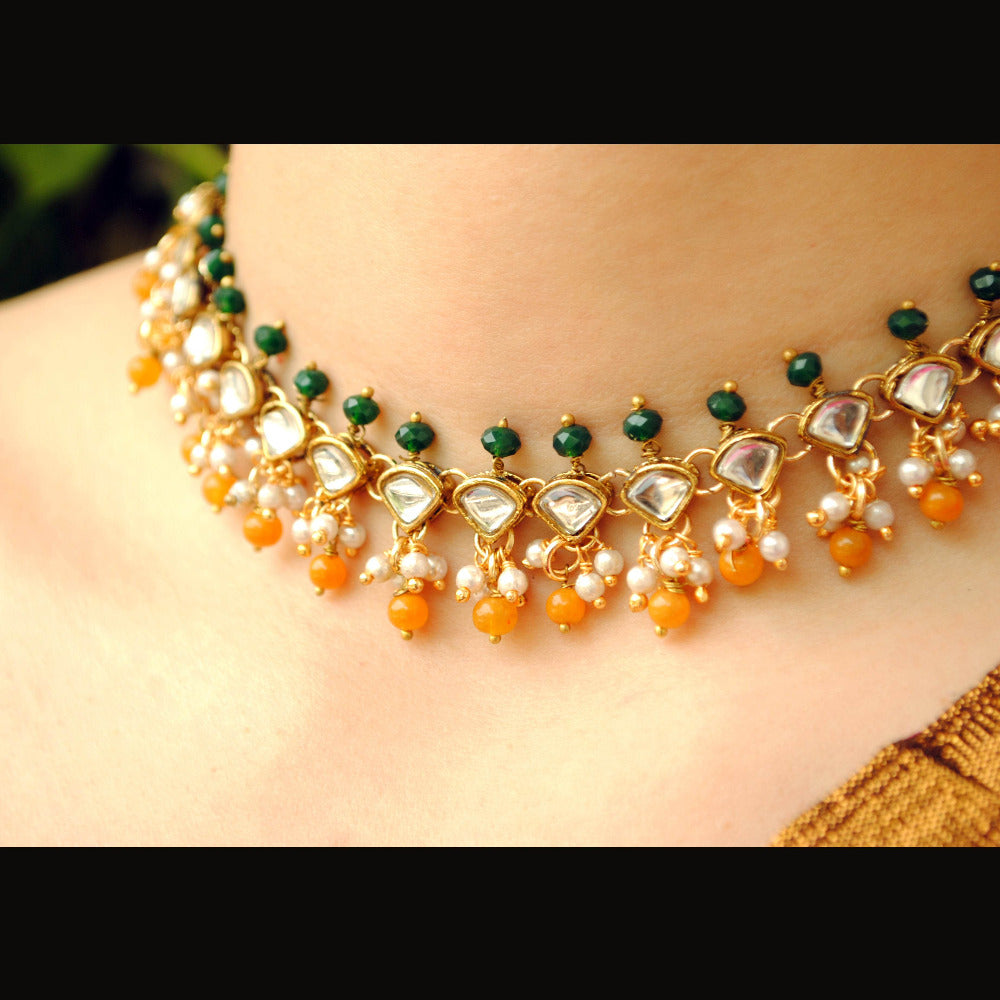 Kundan choker set in gold-tone with matching earrings and long bridal necklace, perfect for wedding functions , festive and bridal wear