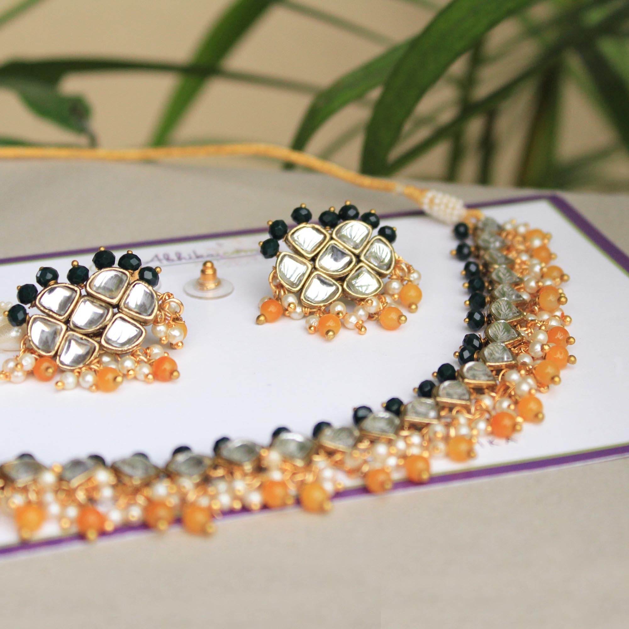 Kundan choker set in gold-tone with matching earrings and long bridal necklace, perfect for wedding functions , festive and bridal wear