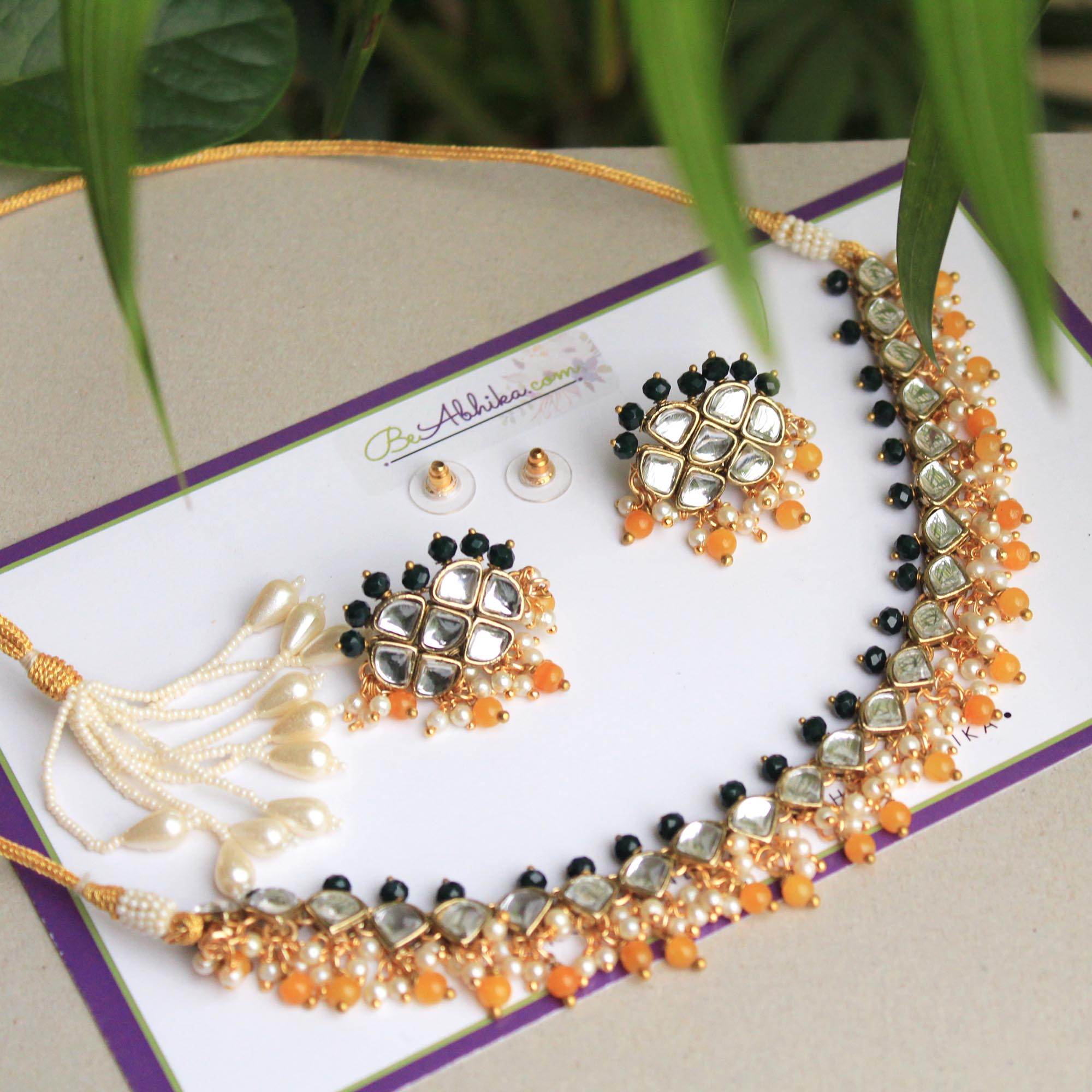 Kundan choker set in gold-tone with matching earrings and long bridal necklace, perfect for wedding functions , festive and bridal wear