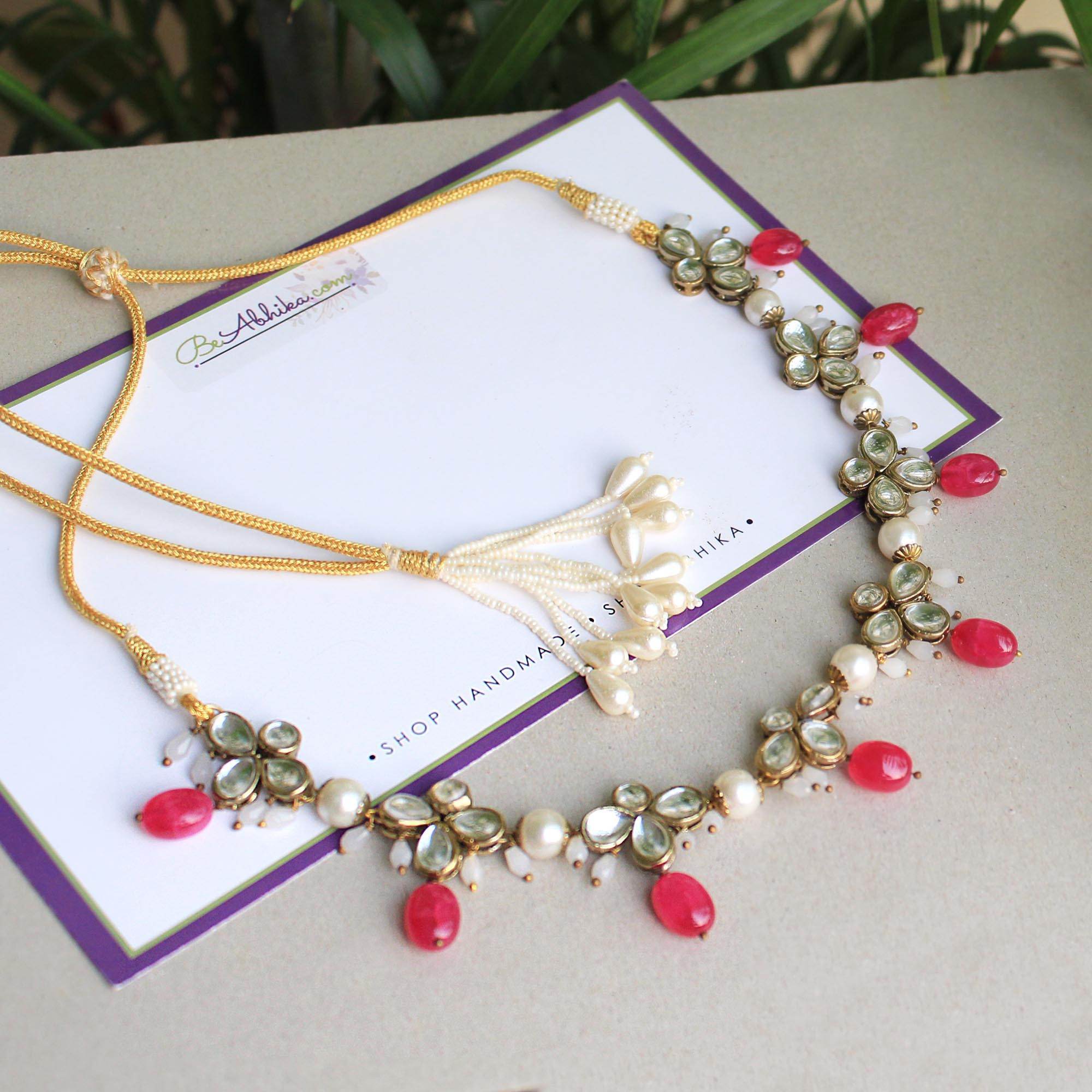 Kundan choker set in gold-tone with matching earrings and long bridal necklace, perfect for wedding functions , festive and bridal wear