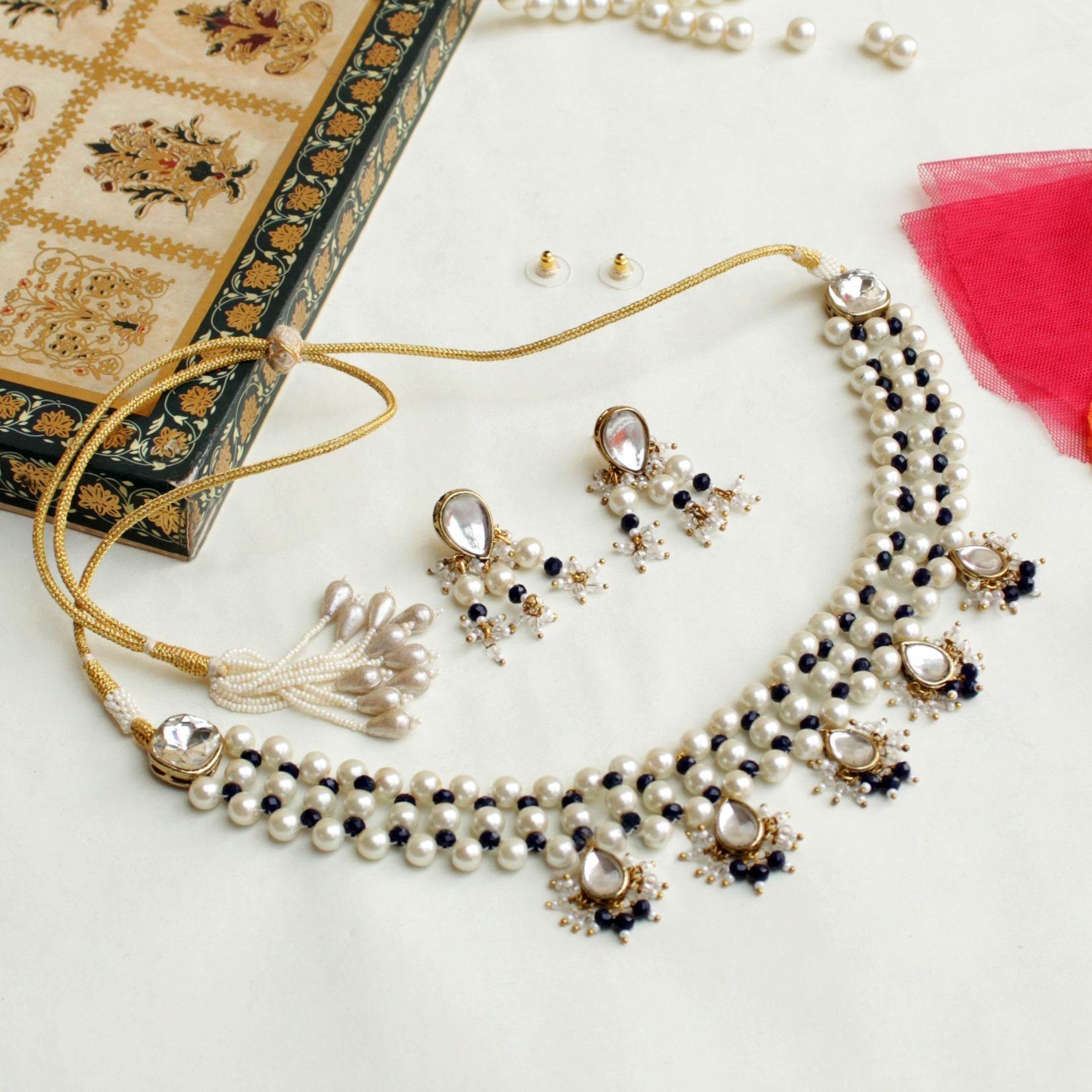 Kundan choker set in gold-tone with matching earrings and long bridal necklace, perfect for wedding functions , festive and bridal wear