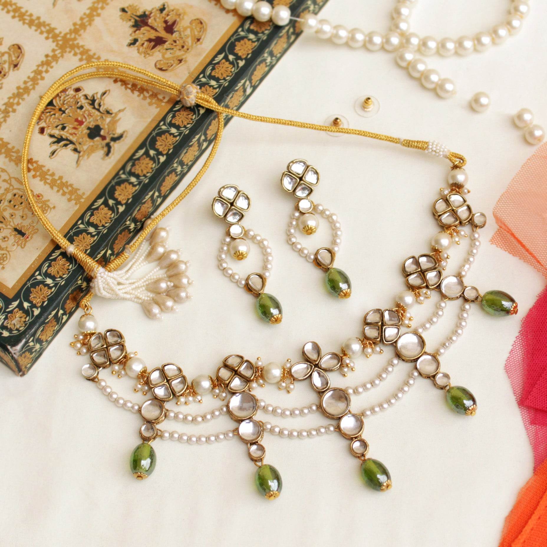 Kundan choker set in gold-tone with matching earrings and long bridal necklace, perfect for wedding functions , festive and bridal wear