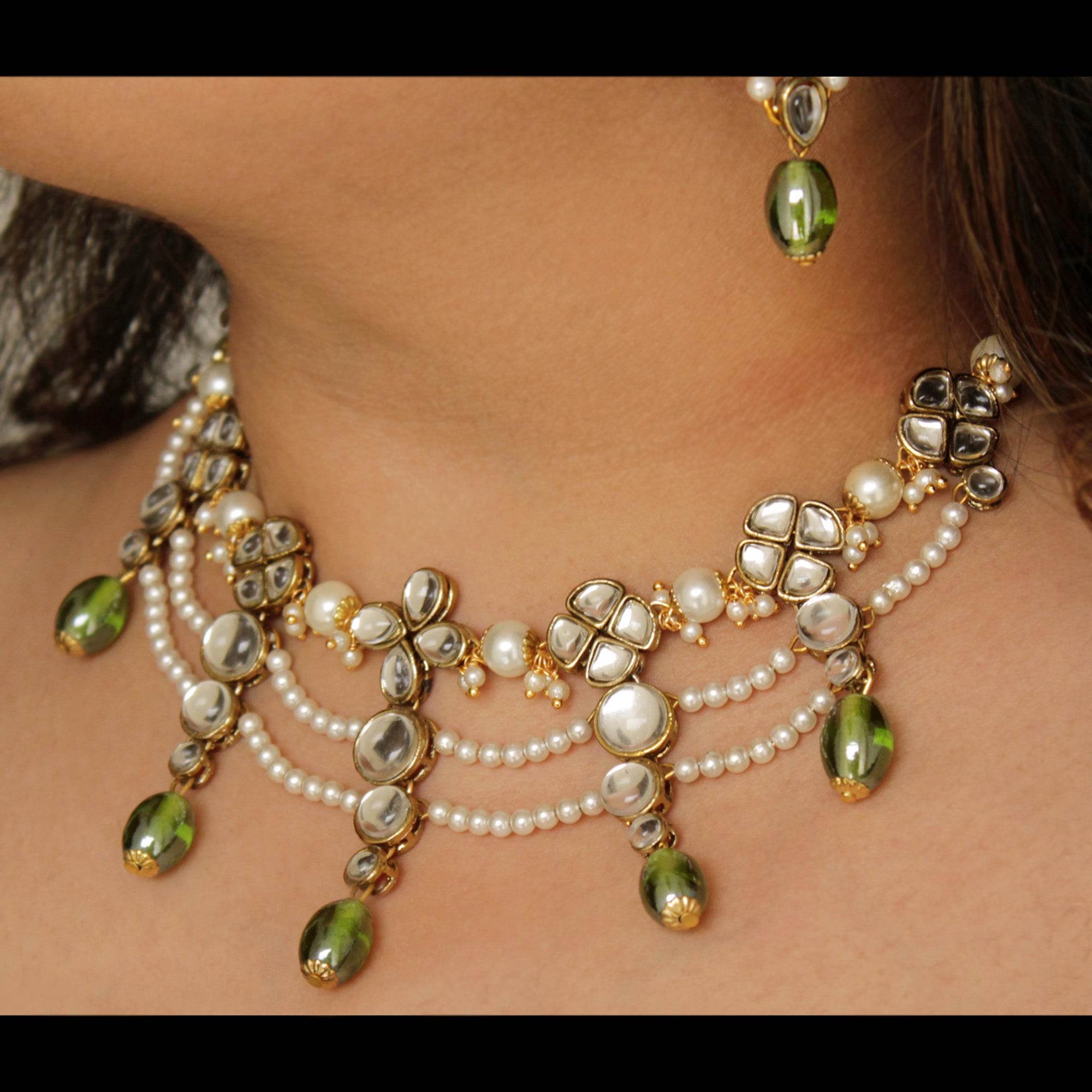 Kundan choker set in gold-tone with matching earrings and long bridal necklace, perfect for wedding functions , festive and bridal wear
