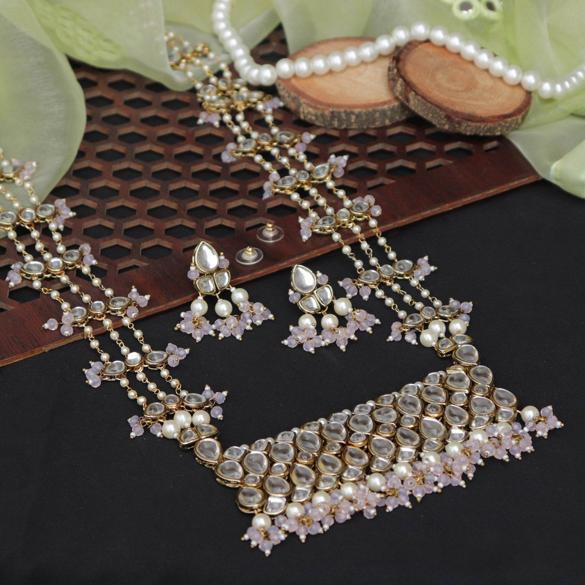 Kundan choker set in gold-tone with matching earrings and long bridal necklace, perfect for wedding functions , festive and bridal wear