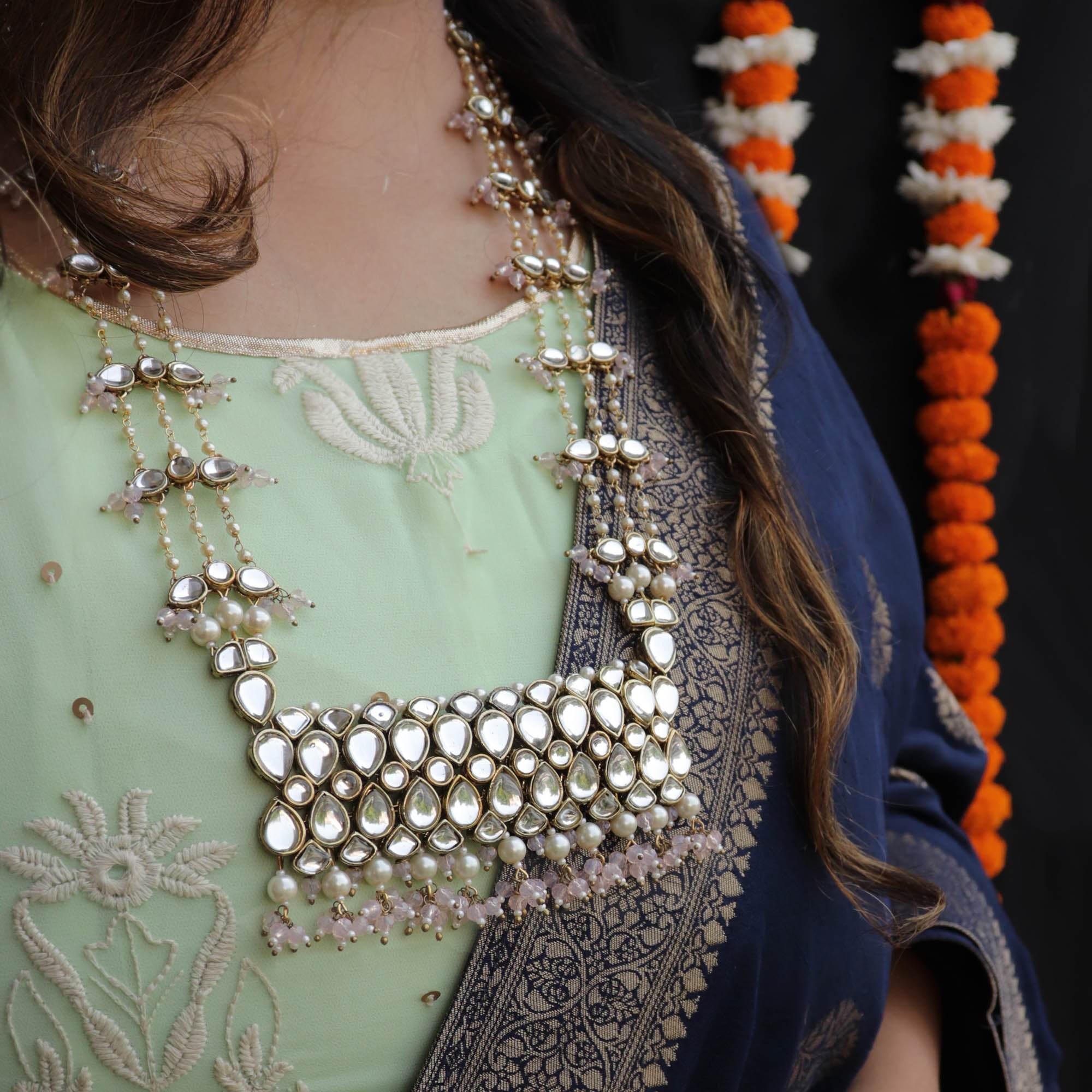 Kundan choker set in gold-tone with matching earrings and long bridal necklace, perfect for wedding functions , festive and bridal wear