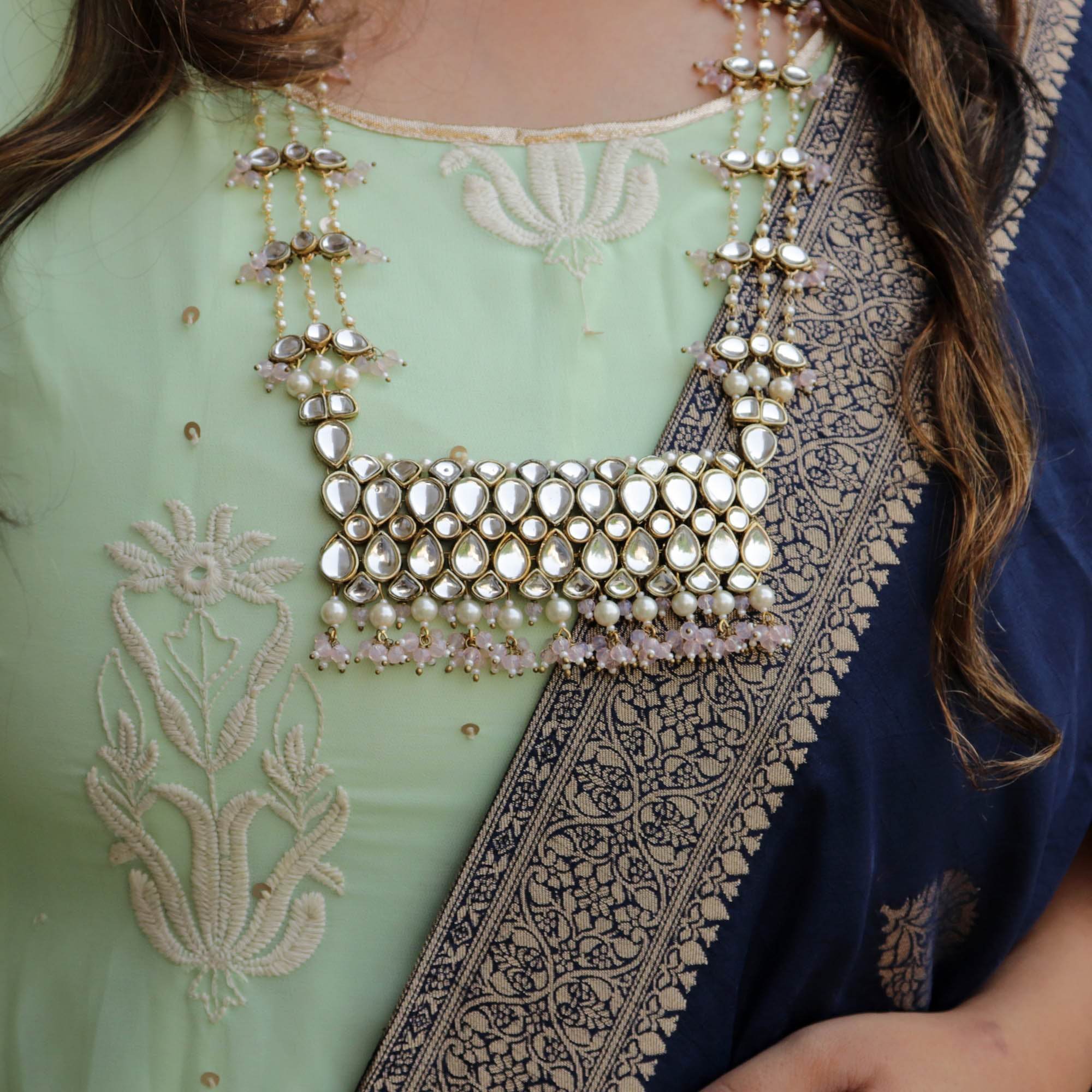 Kundan choker set in gold-tone with matching earrings and long bridal necklace, perfect for wedding functions , festive and bridal wear